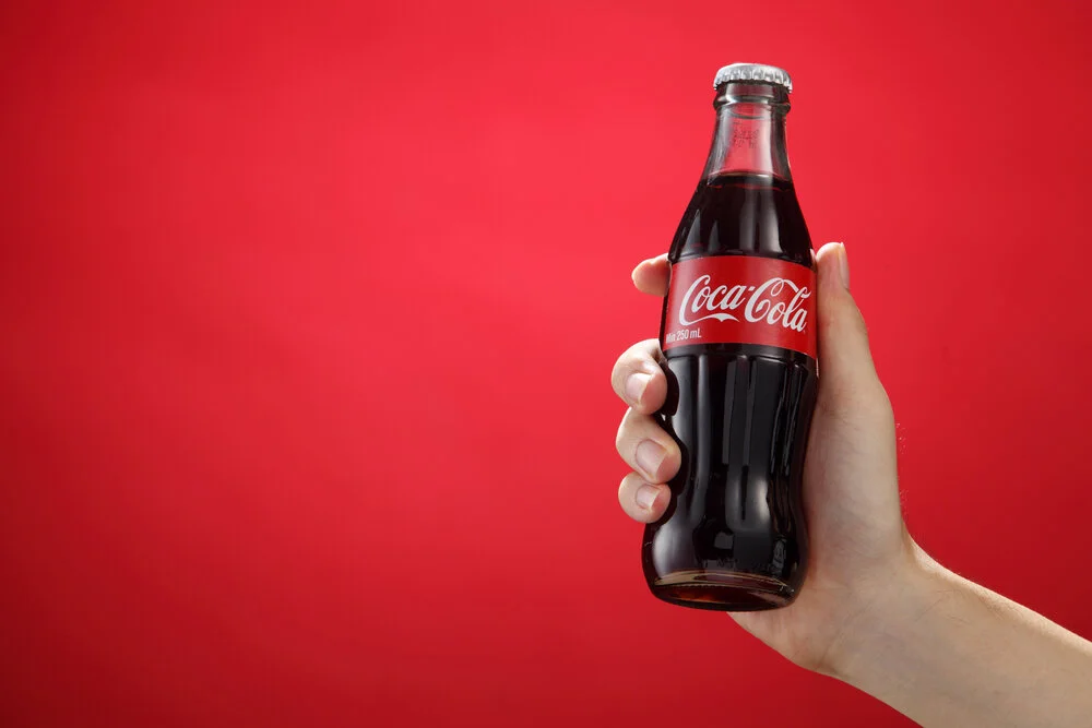 hand holding coca cola.jpg