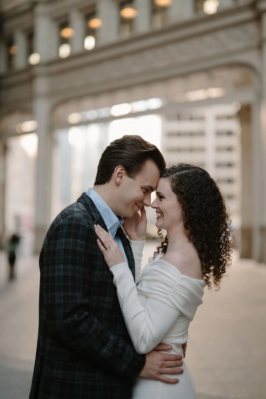 Close-up of a smiling couple touching foreheads during a downtown Chicago engagement photos session