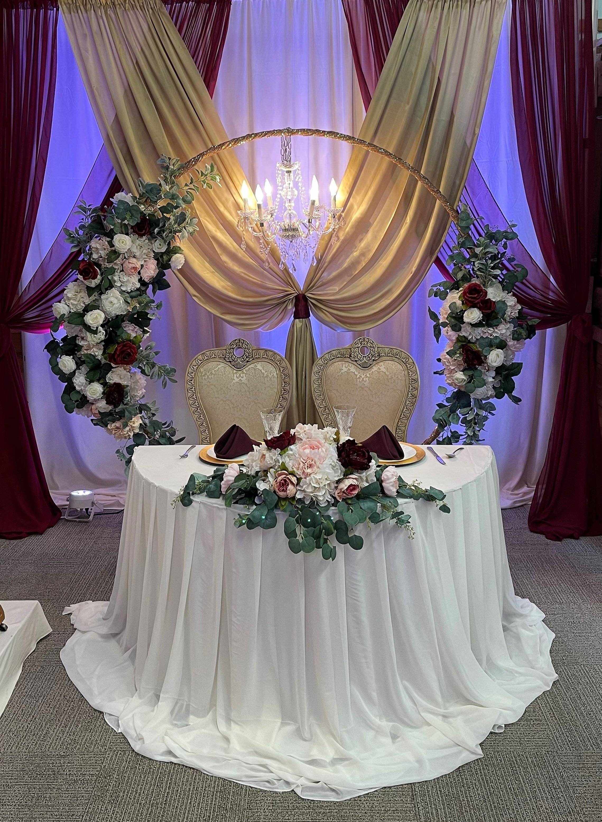 Golden arch with chandelier.jpg