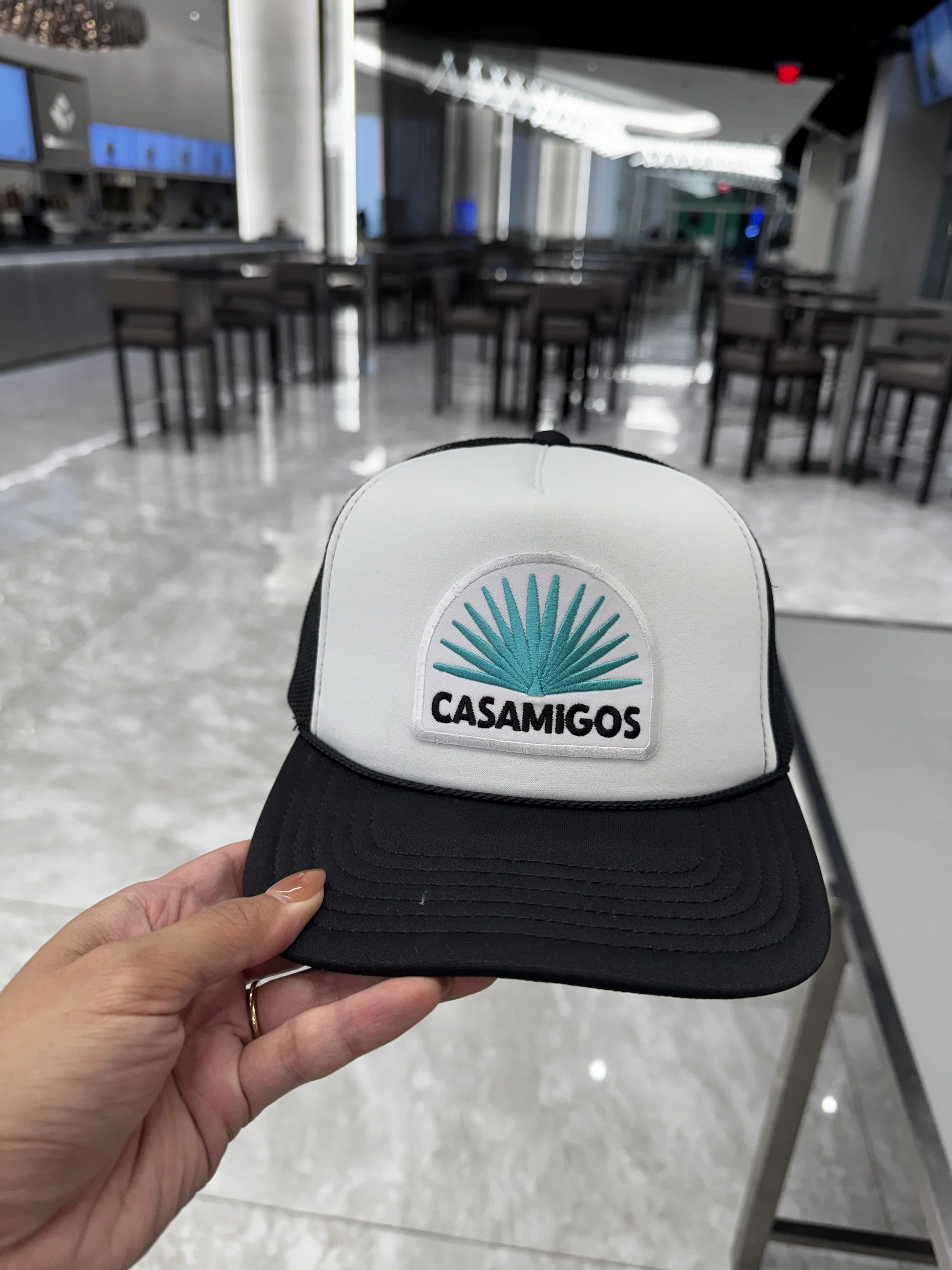 Embroidered Patch with Casamigos agave logo on a black and white trucker hat