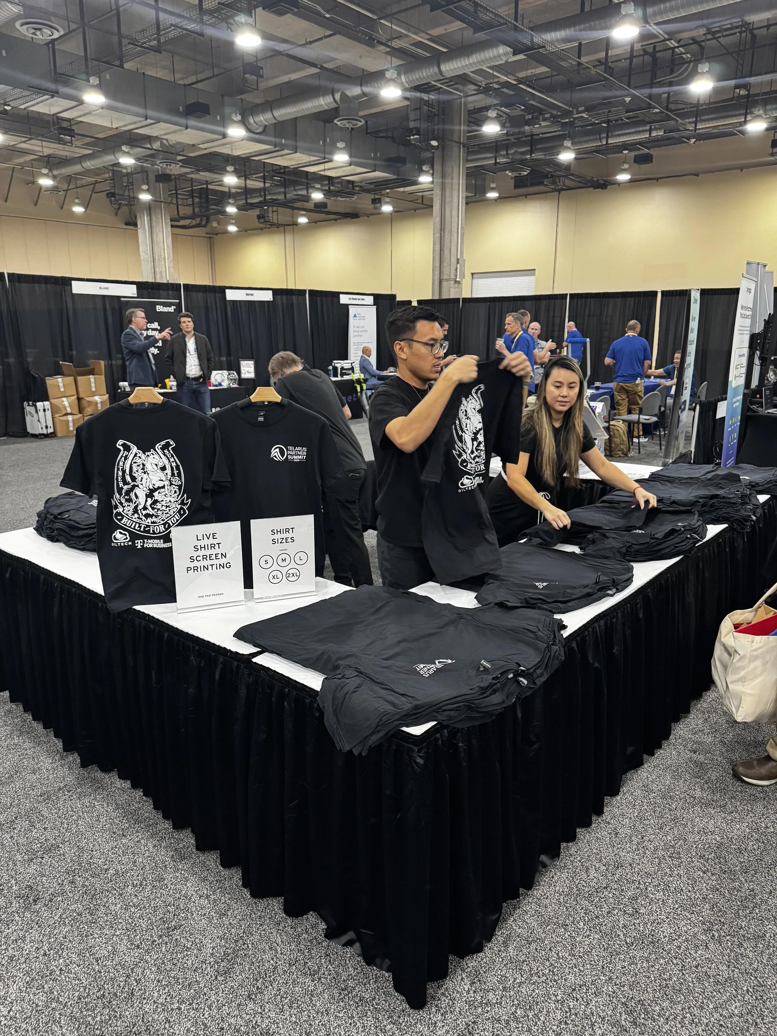 Tables where guest could pick up their shirts that have been made onsite