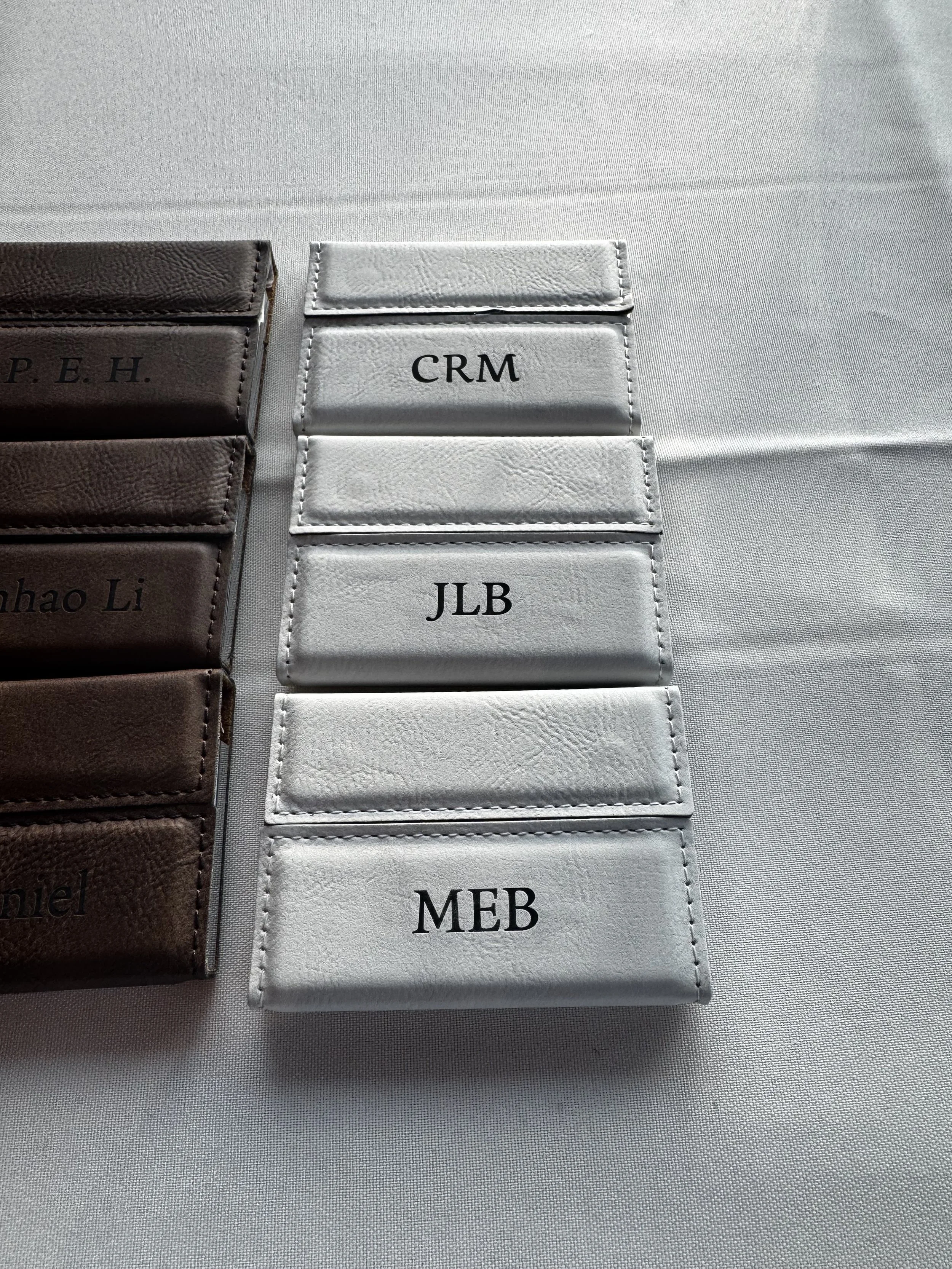 Examples of finished product of live laser engraved business card holders