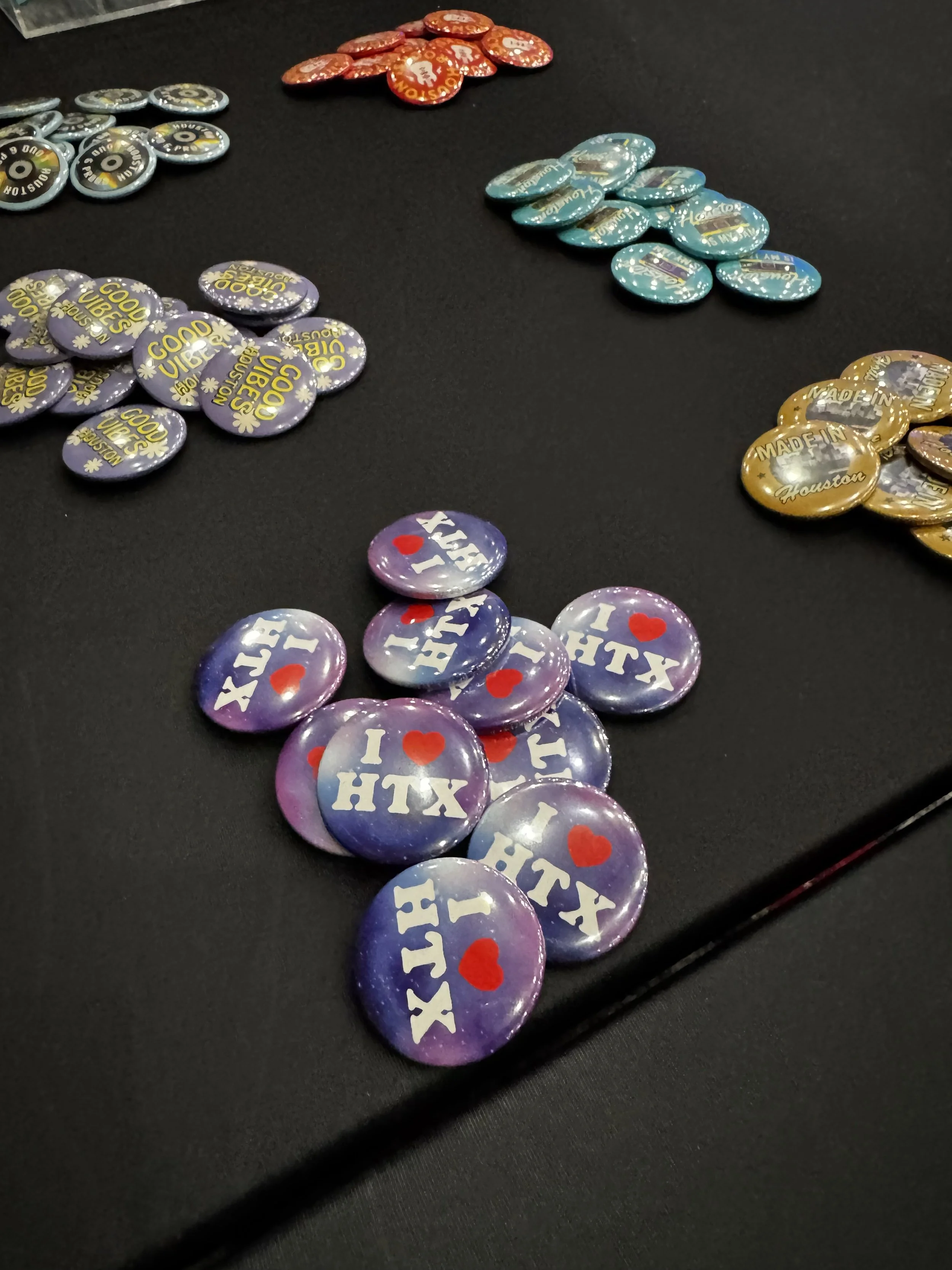 piles of multiple pre pressed buttons available for employees to choose from