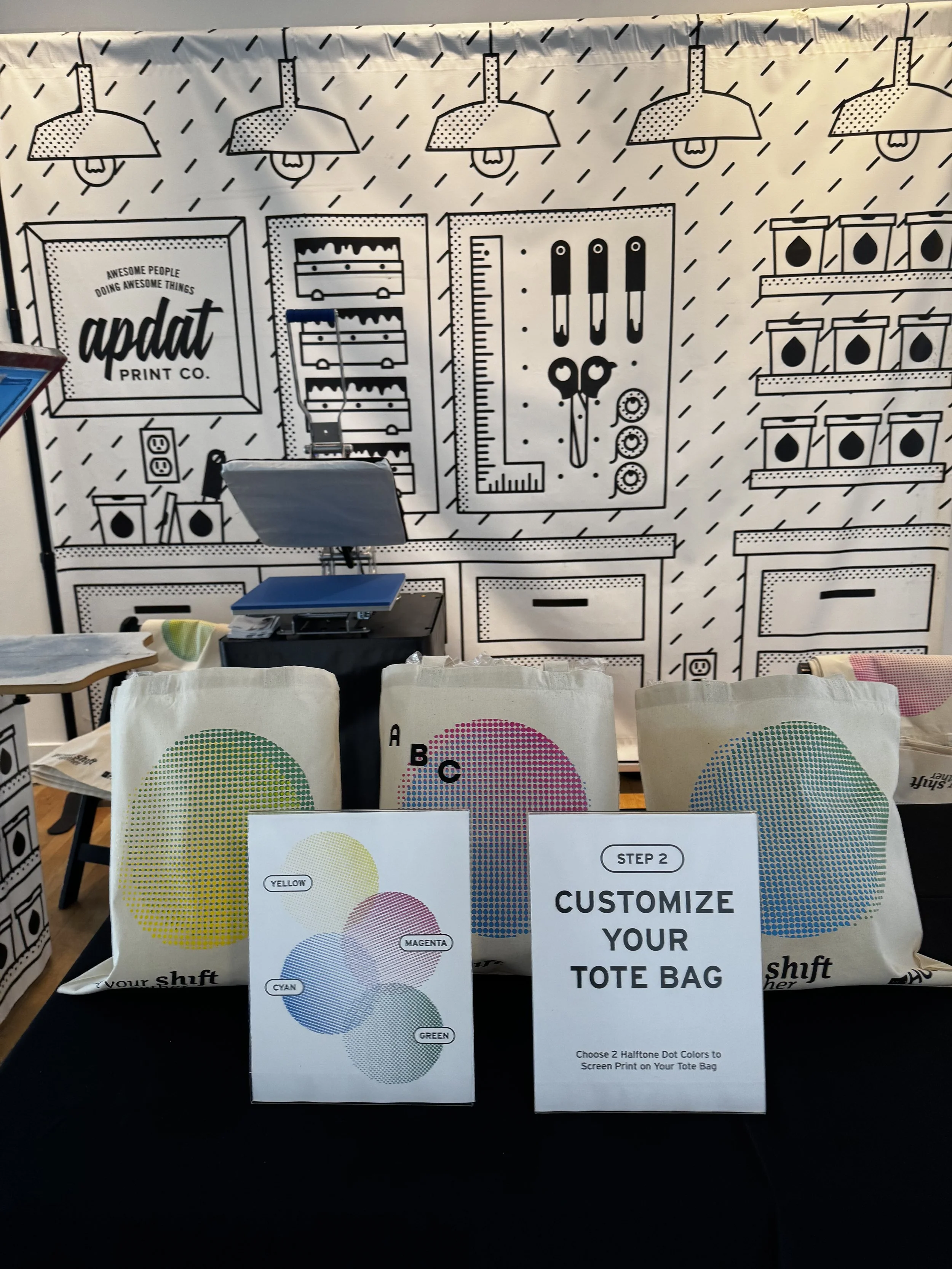 Set up at AIGA where we screen printed tote bags live and then used heat press to apply monograms