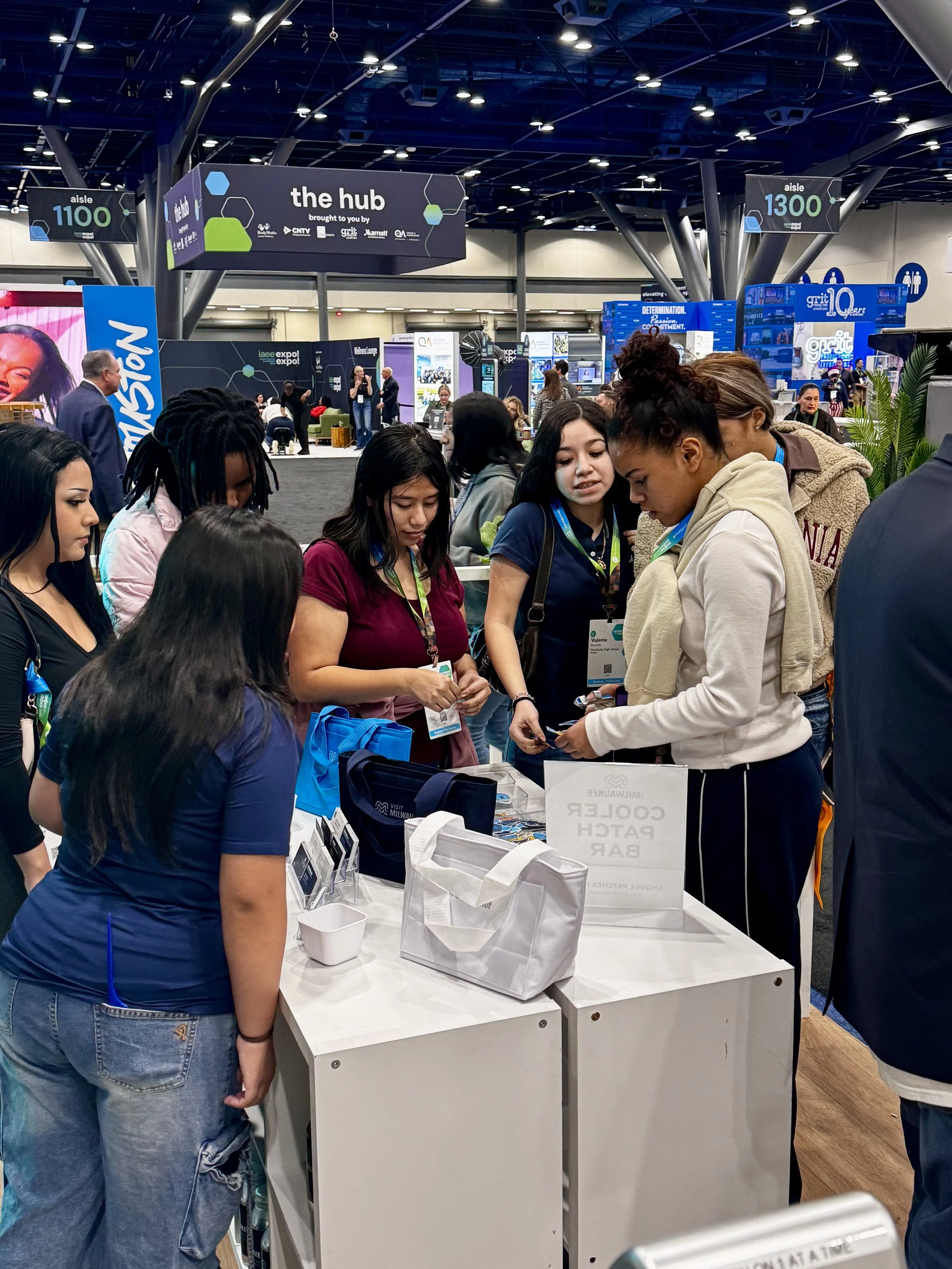 Guests gather and contemplate patch selection before bringing them over to heat press for us to apply