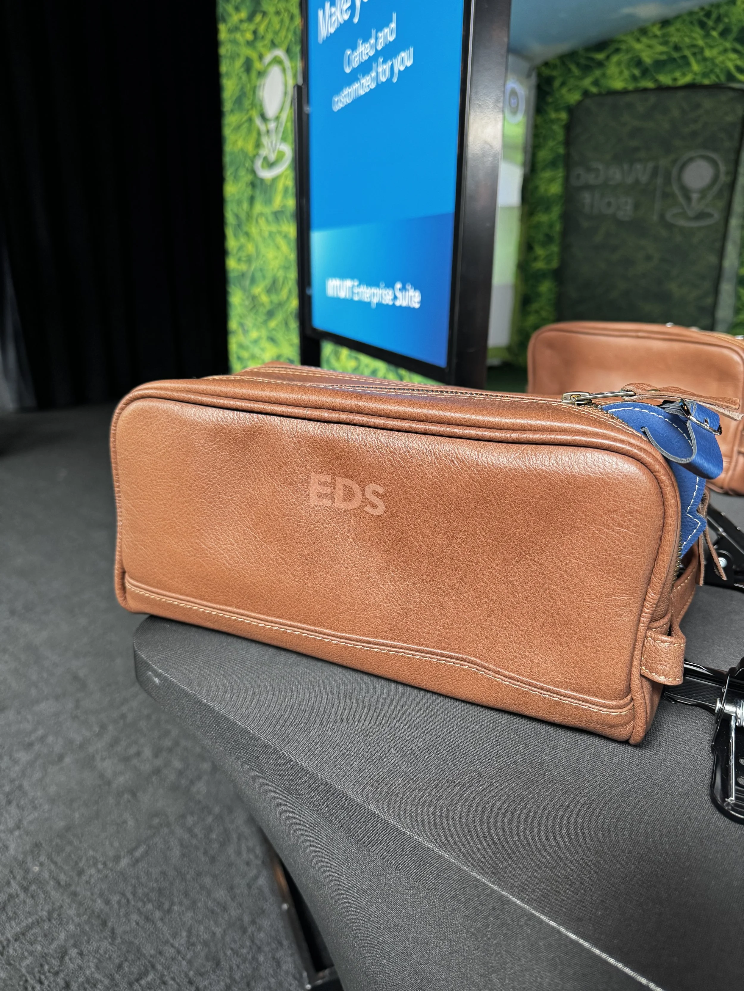 Laser monogrammed leather dopp kit provided for clients at Intuit client event