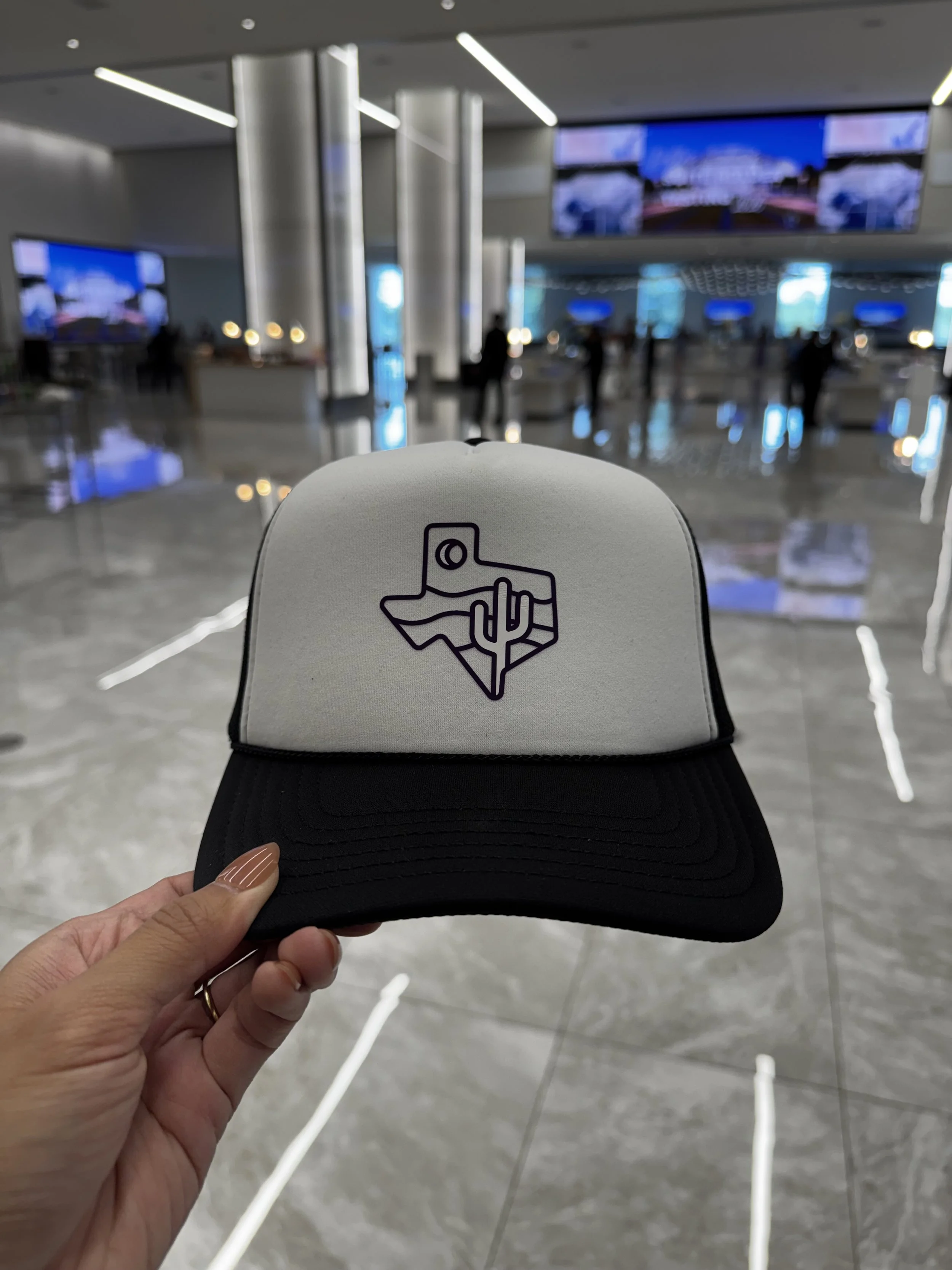 Trucker Hat with Texas shape and desert scene heat pressed live.