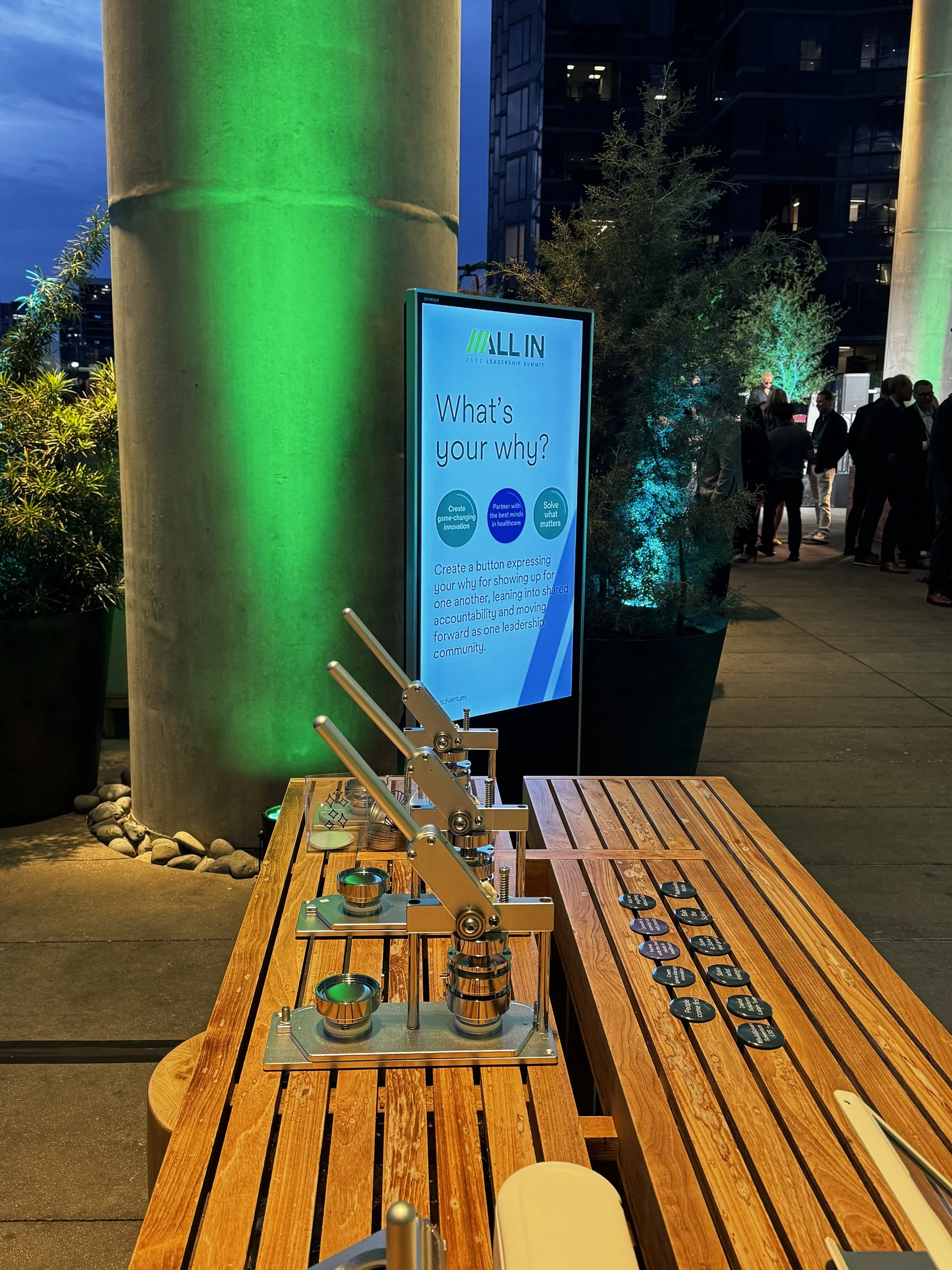 Apdat worked into the evening to press customized buttons for guests live on site