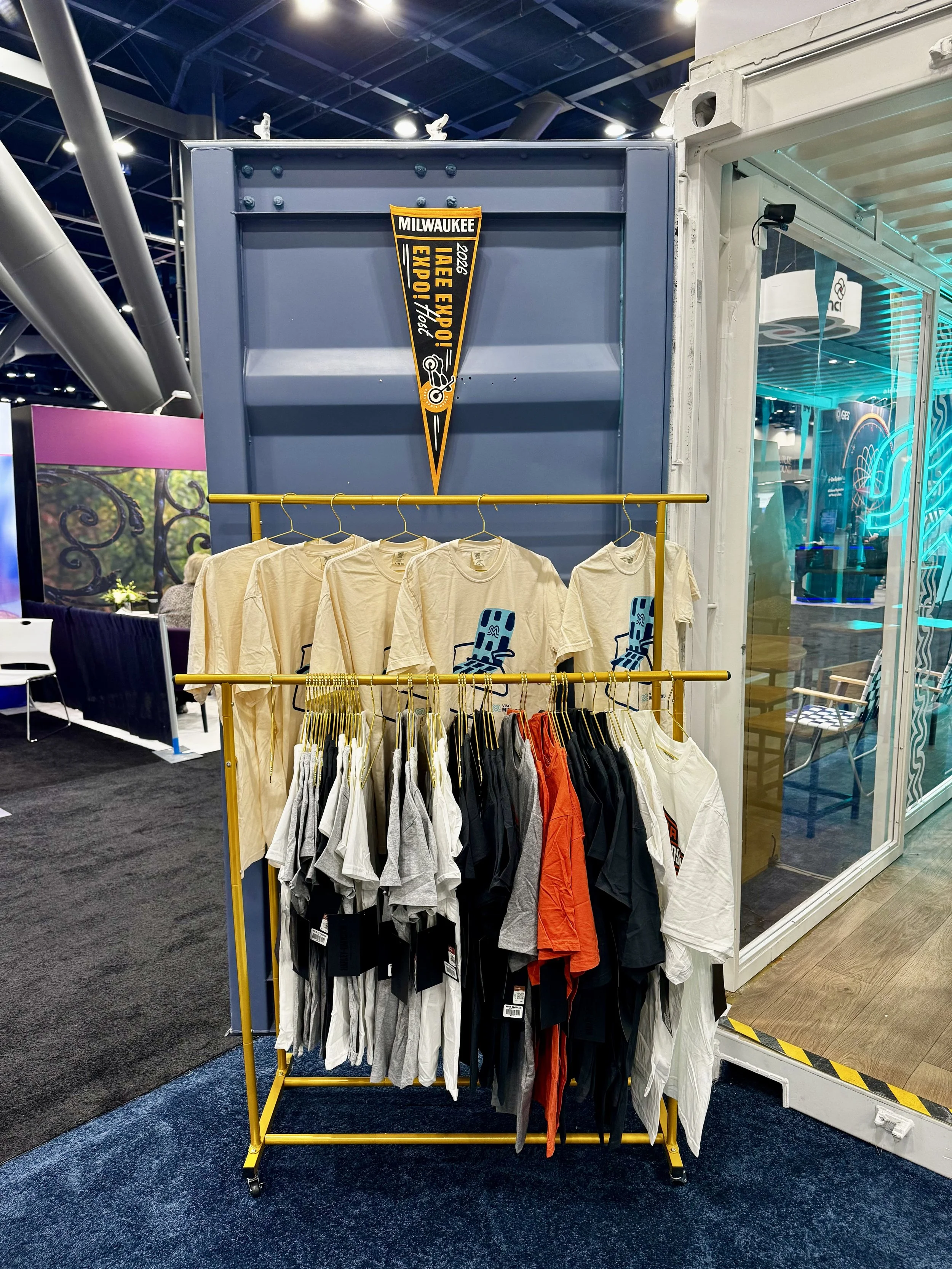 Rack of t-shirts at booth showcasing all the brands you know and love that happen to come from milwaukee