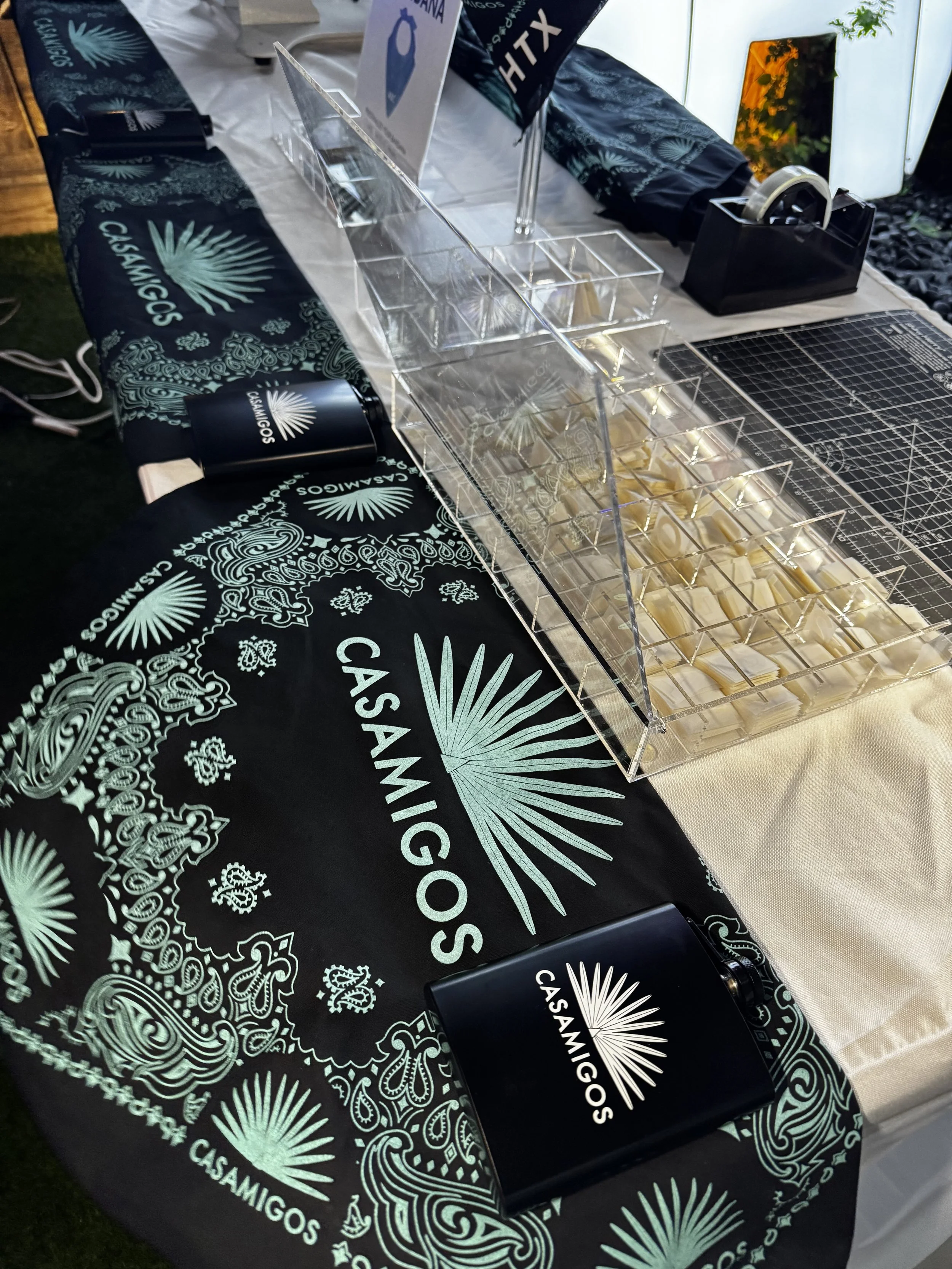 Table set up of Vida Garden bandana monogramming live activation