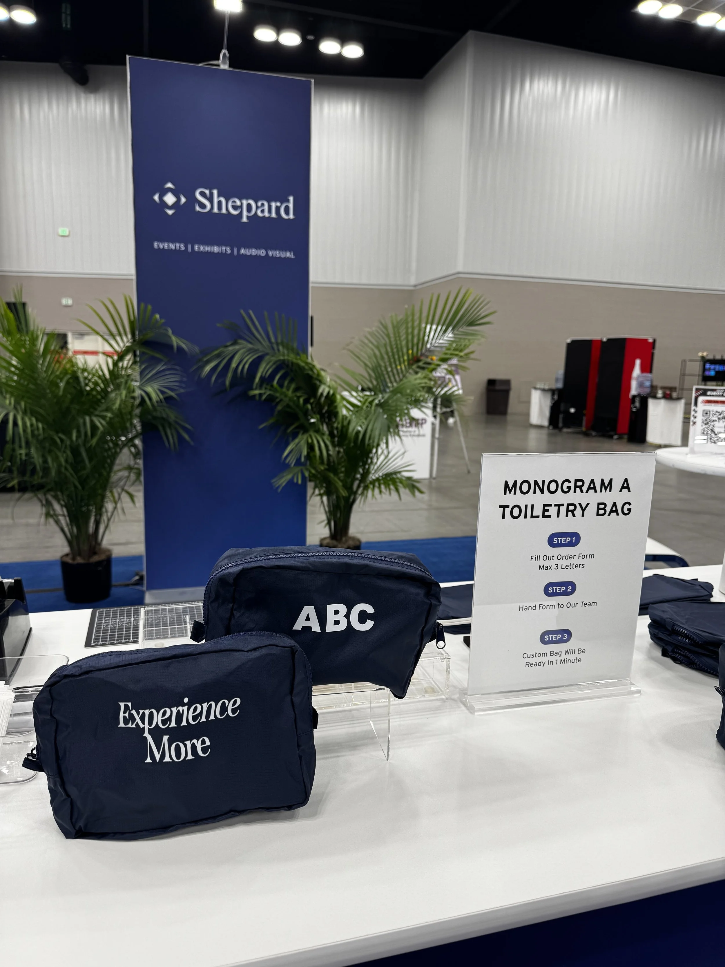 Toiletry bags on display showing off front and back imprint