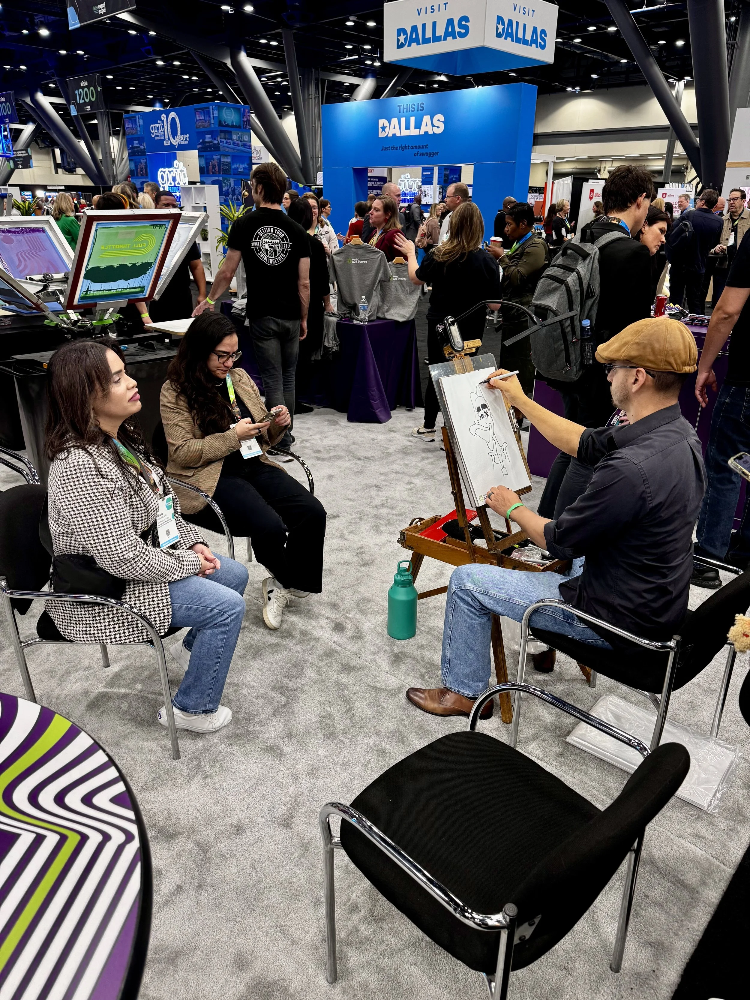 caricature artist captures event attendees likeness while personify staff has opportunity to talk to them about products and services