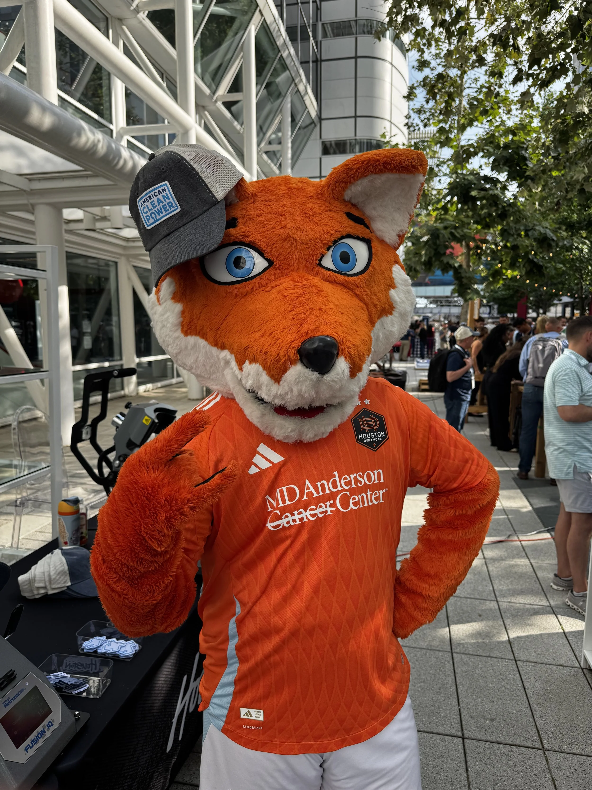 Dynamo mascot, Diesel models one of the hats pressed live on site at ACP opening reception.