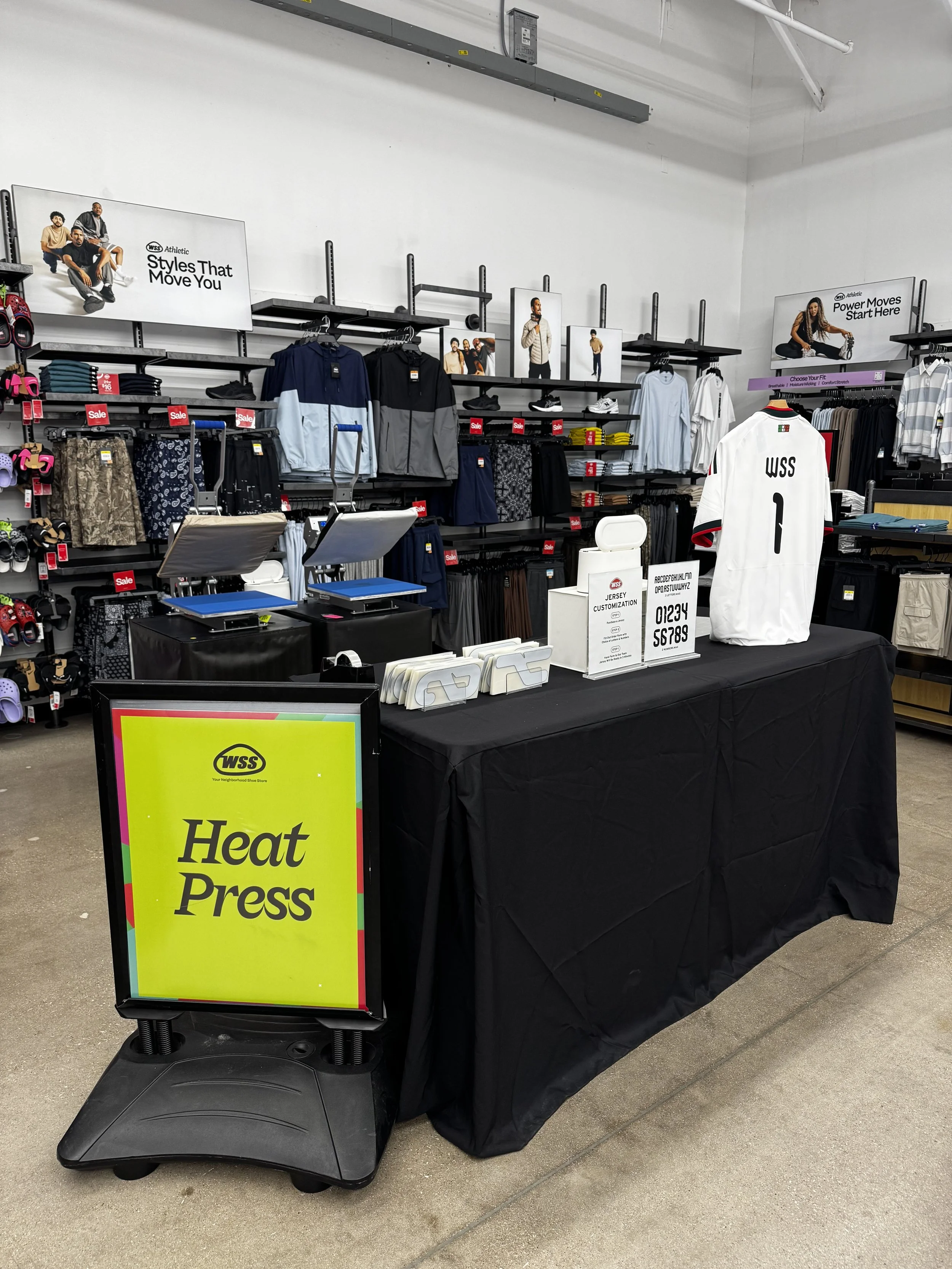 In store set up where people could bring their purchased jersey to be monogrammed using heat press decals