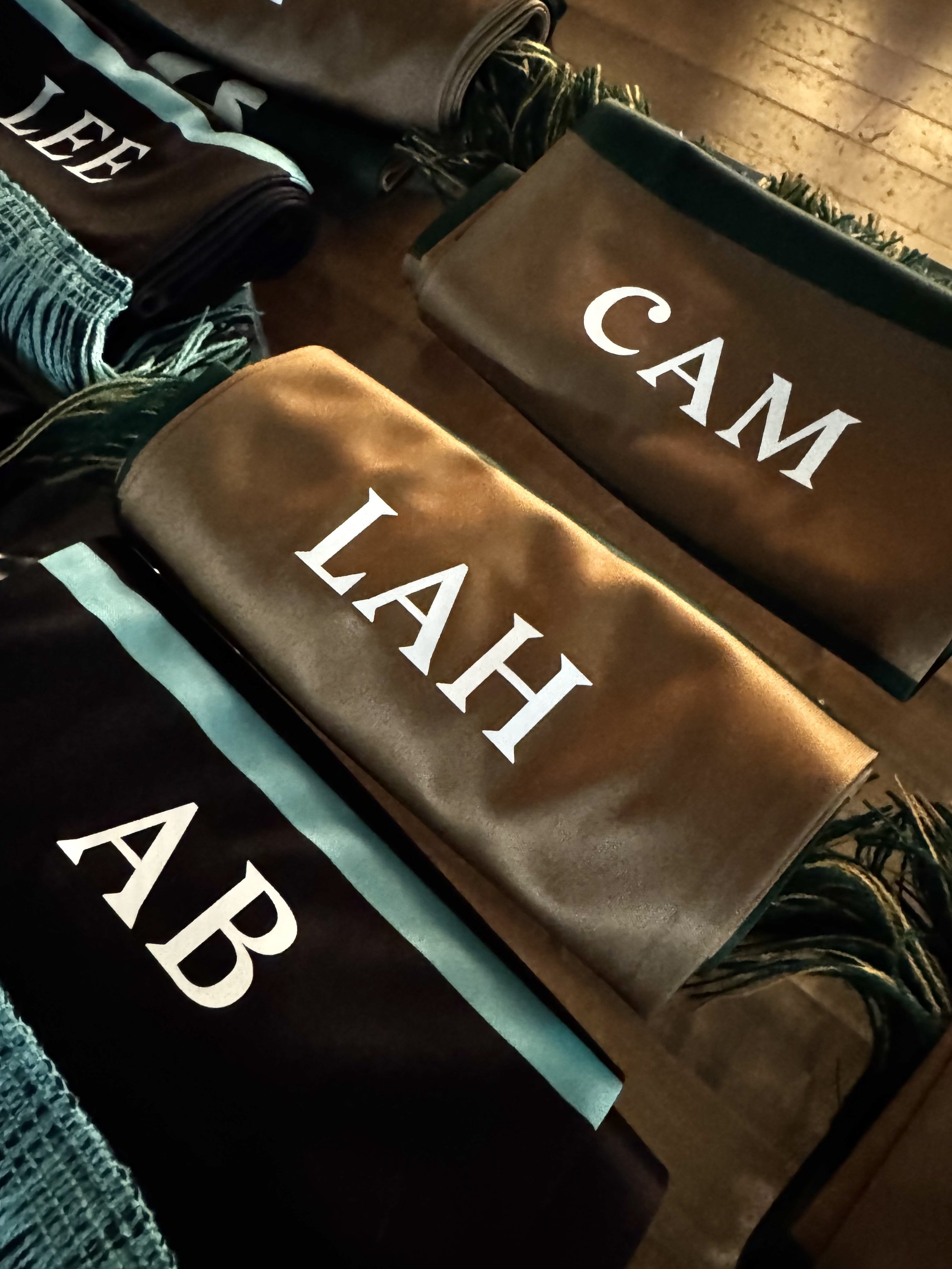 Examples of monogram laid out tidily on table for guests to pickup