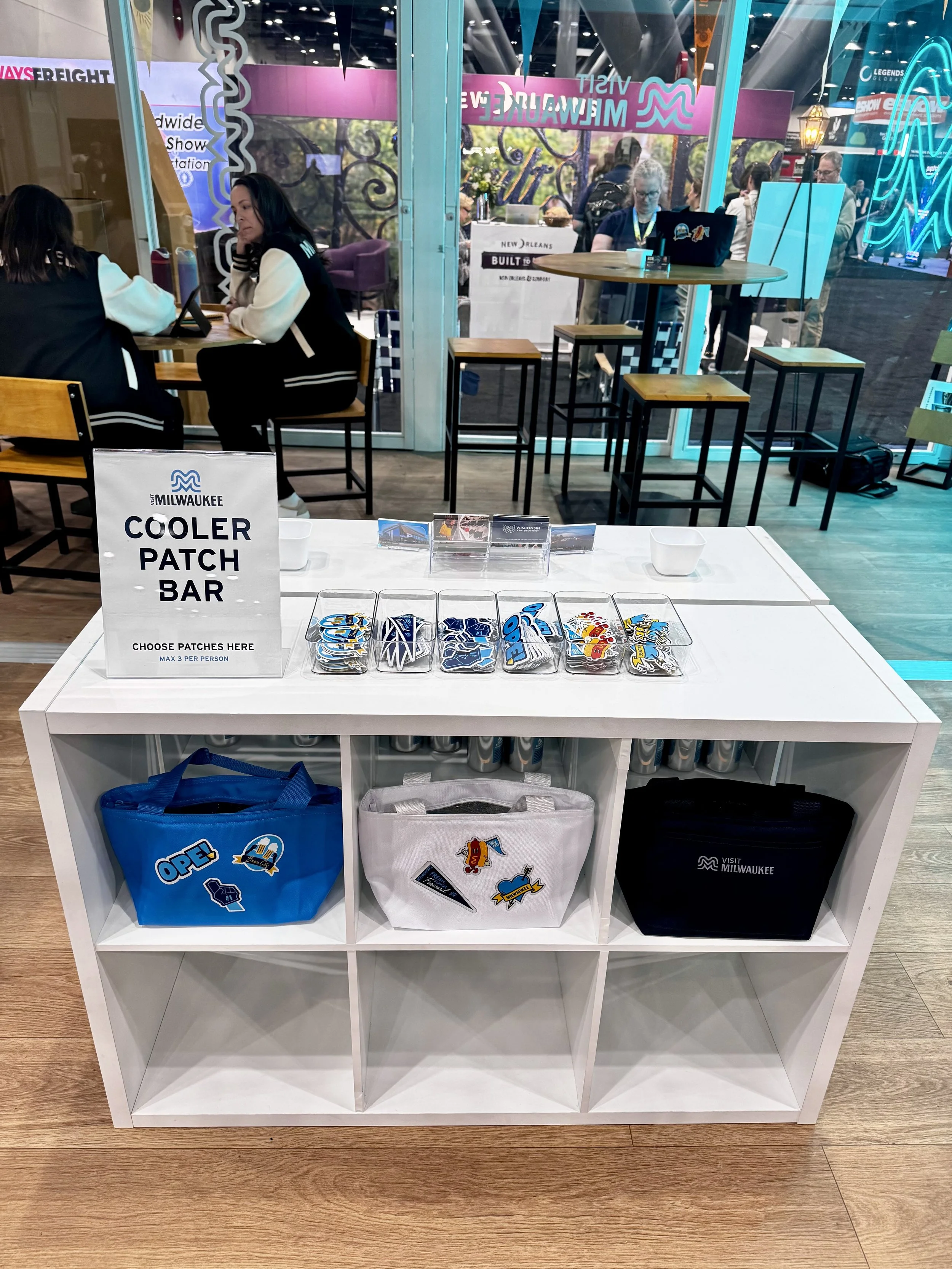 Front view of patch bar where guests can select which woven patch they would like to have applied to a cooler tote live on site