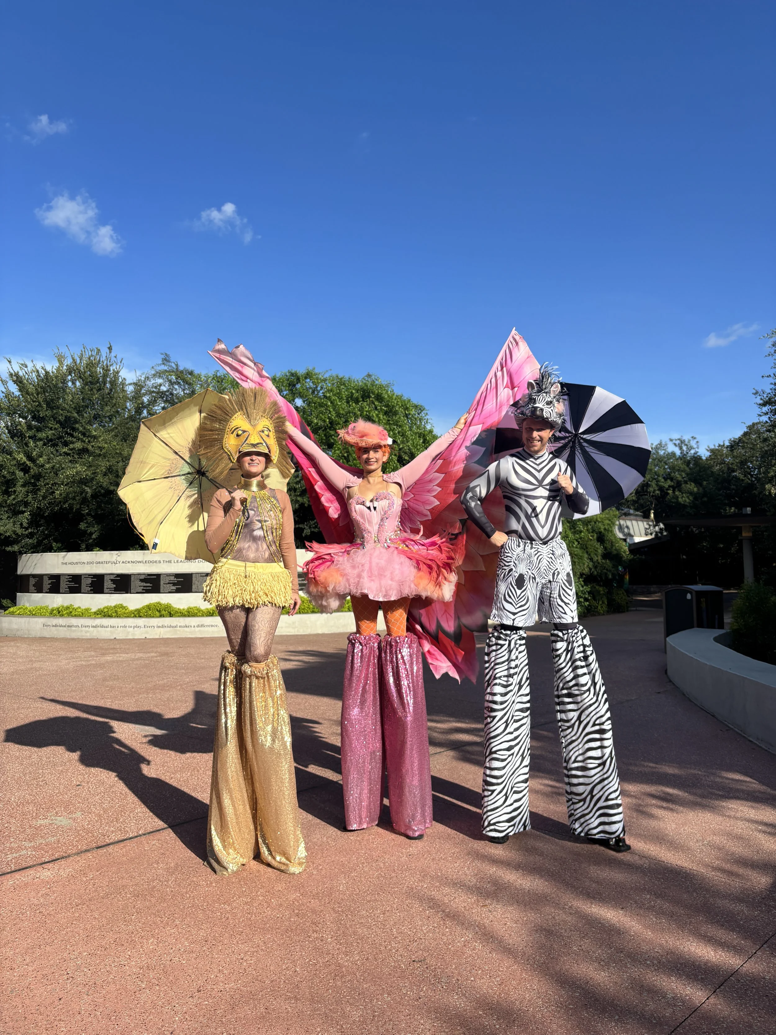 Stilt walkers in animal themed costumes kept the vibes whimsical and fun
