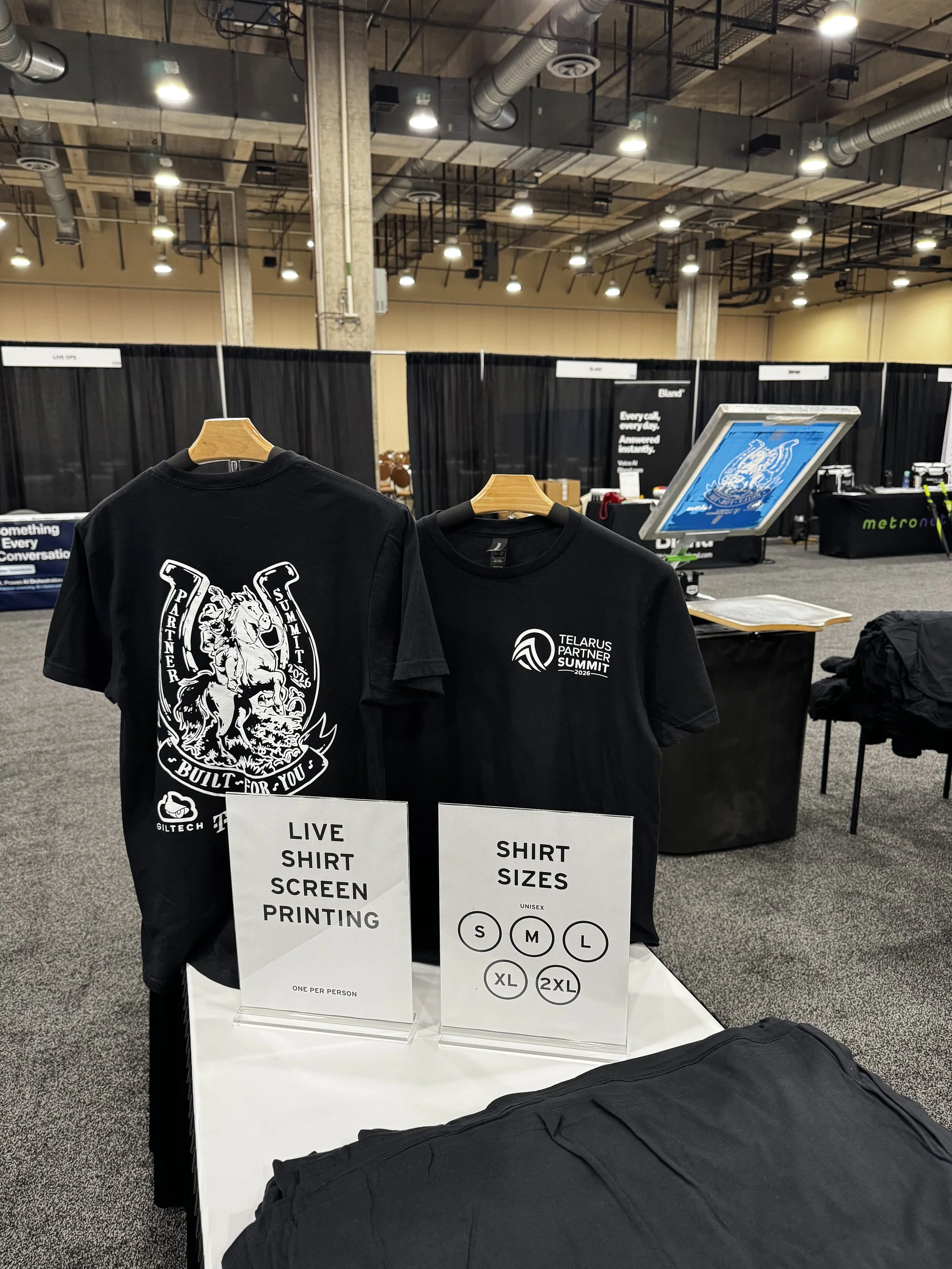 T shirt stands showing off front and back of telarus summit shirts