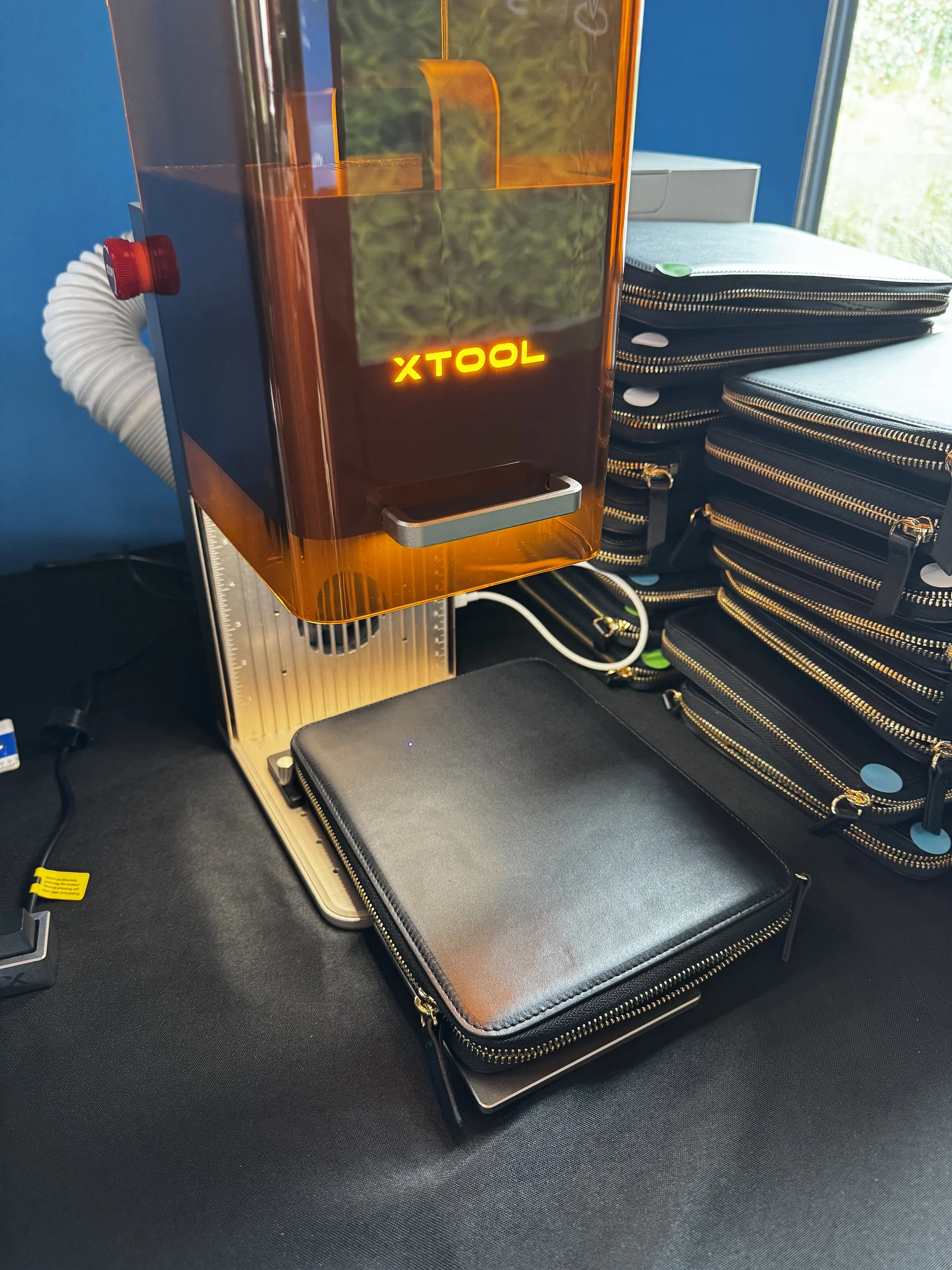 Tech folio lined up and ready to be monogrammed live at Intuit event in Houston, Texas