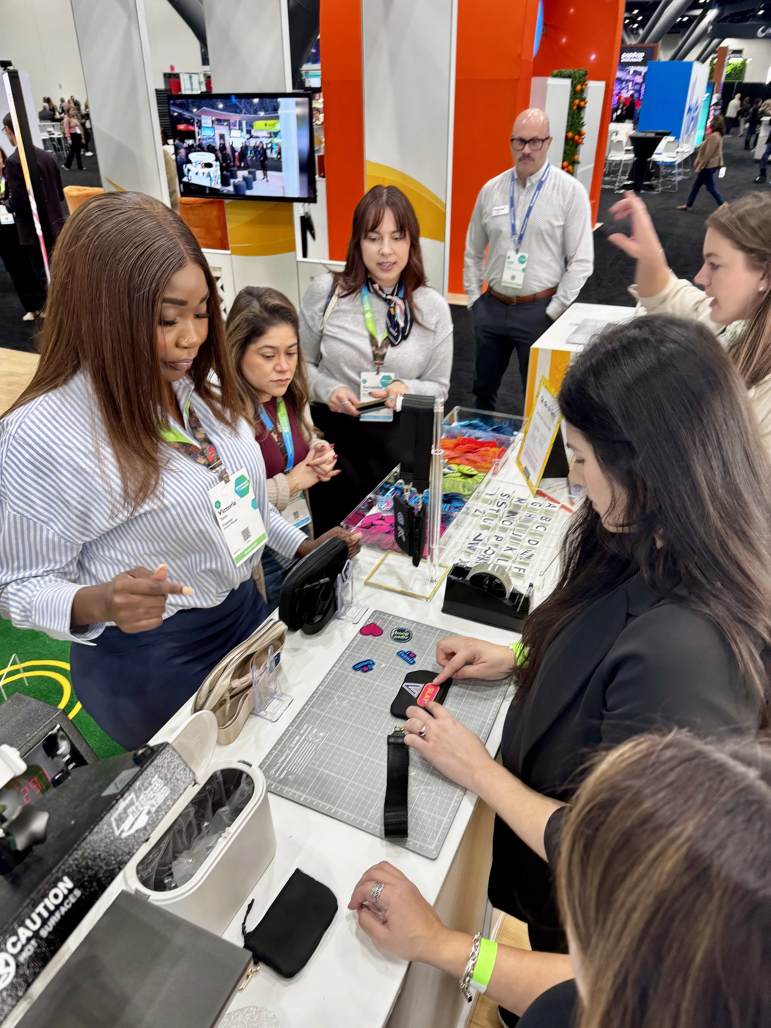 attendees choose between the different designs available and what letters they want applied to the item