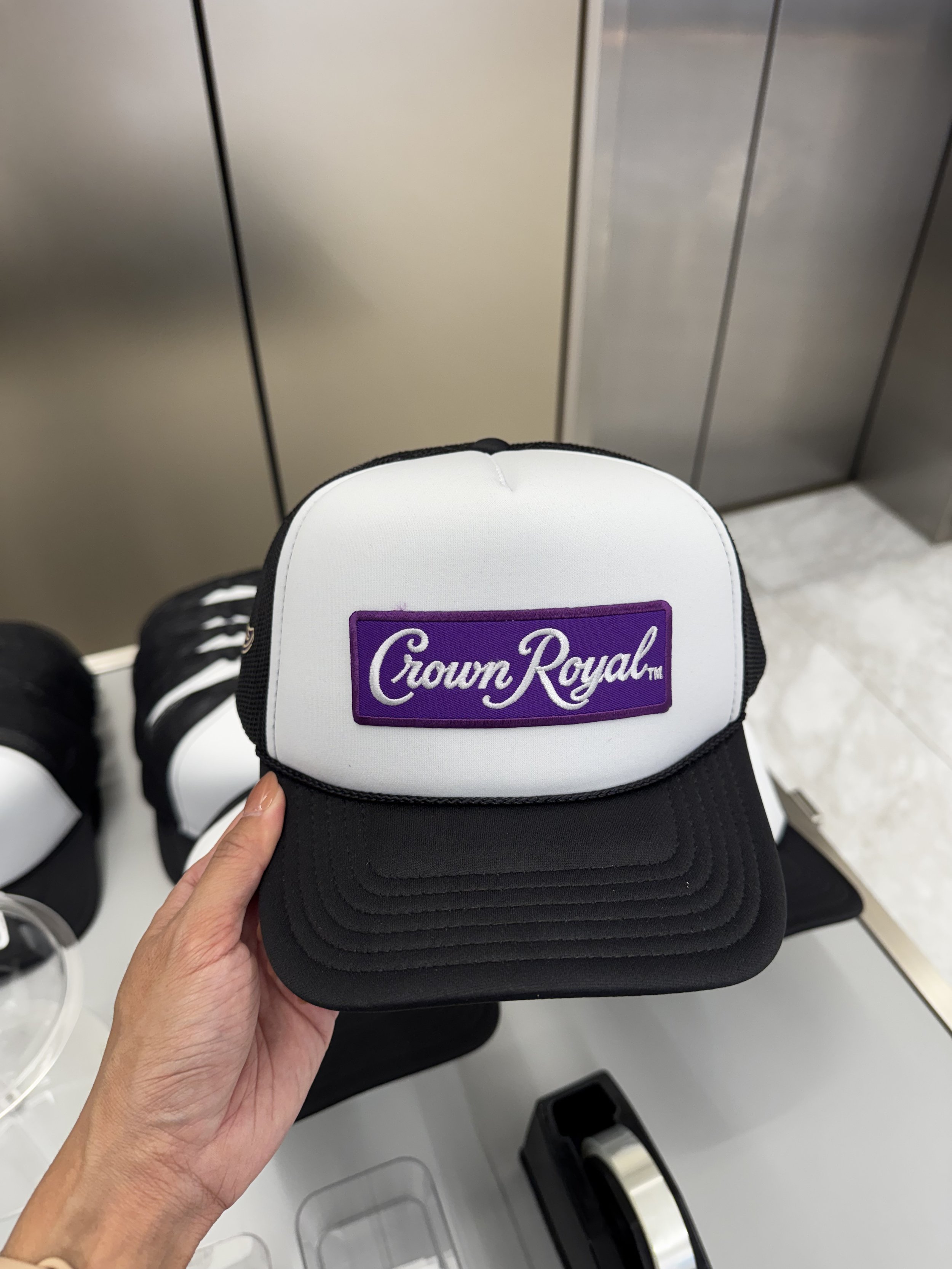 Crown Royal logo patch applied via heat and pressure live on site