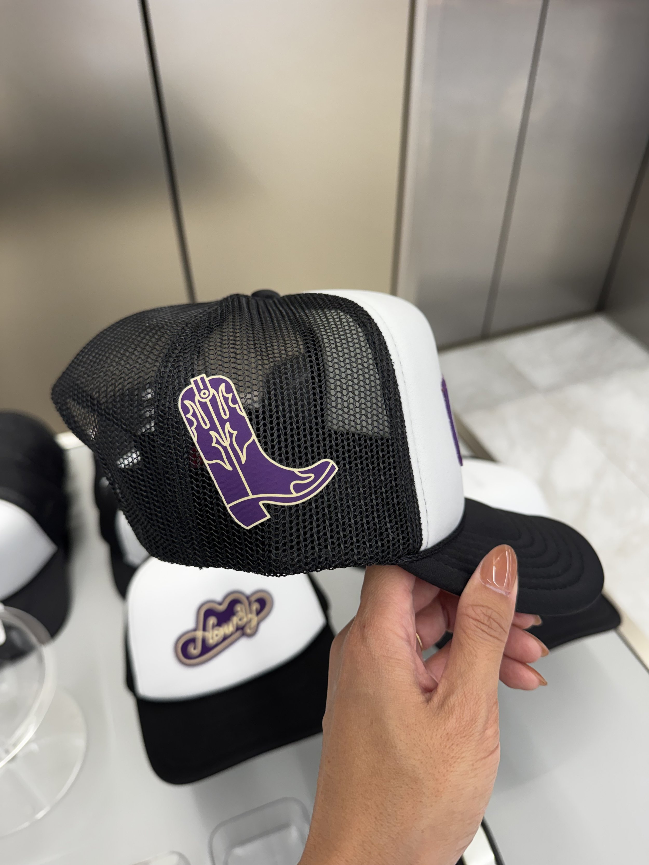 Side of Trucker Hat with Boot in Crown Royal colors heat pressed onto hat live on site