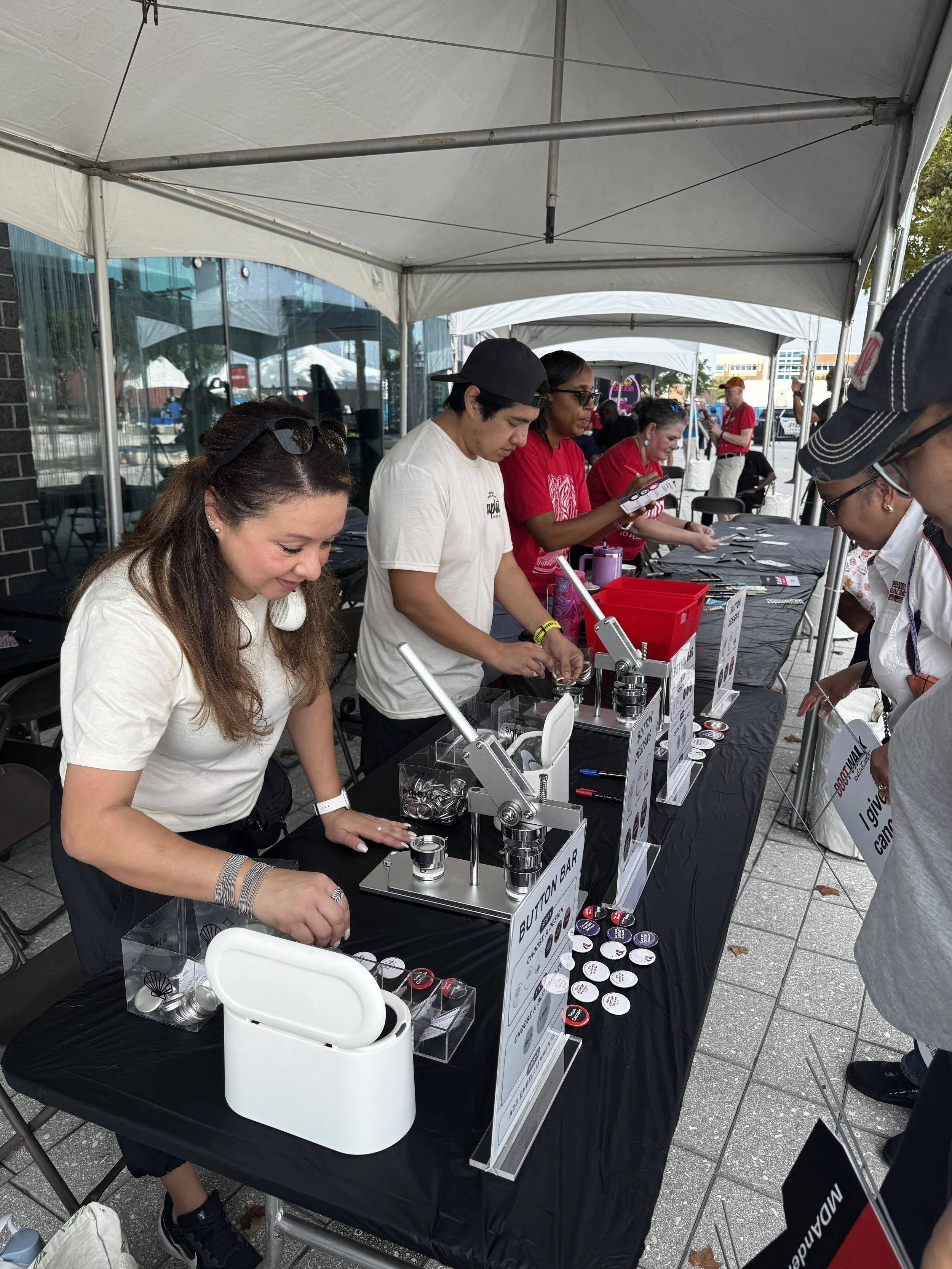 Apdat staff pressing buttons live on site for md anderson boot walk event