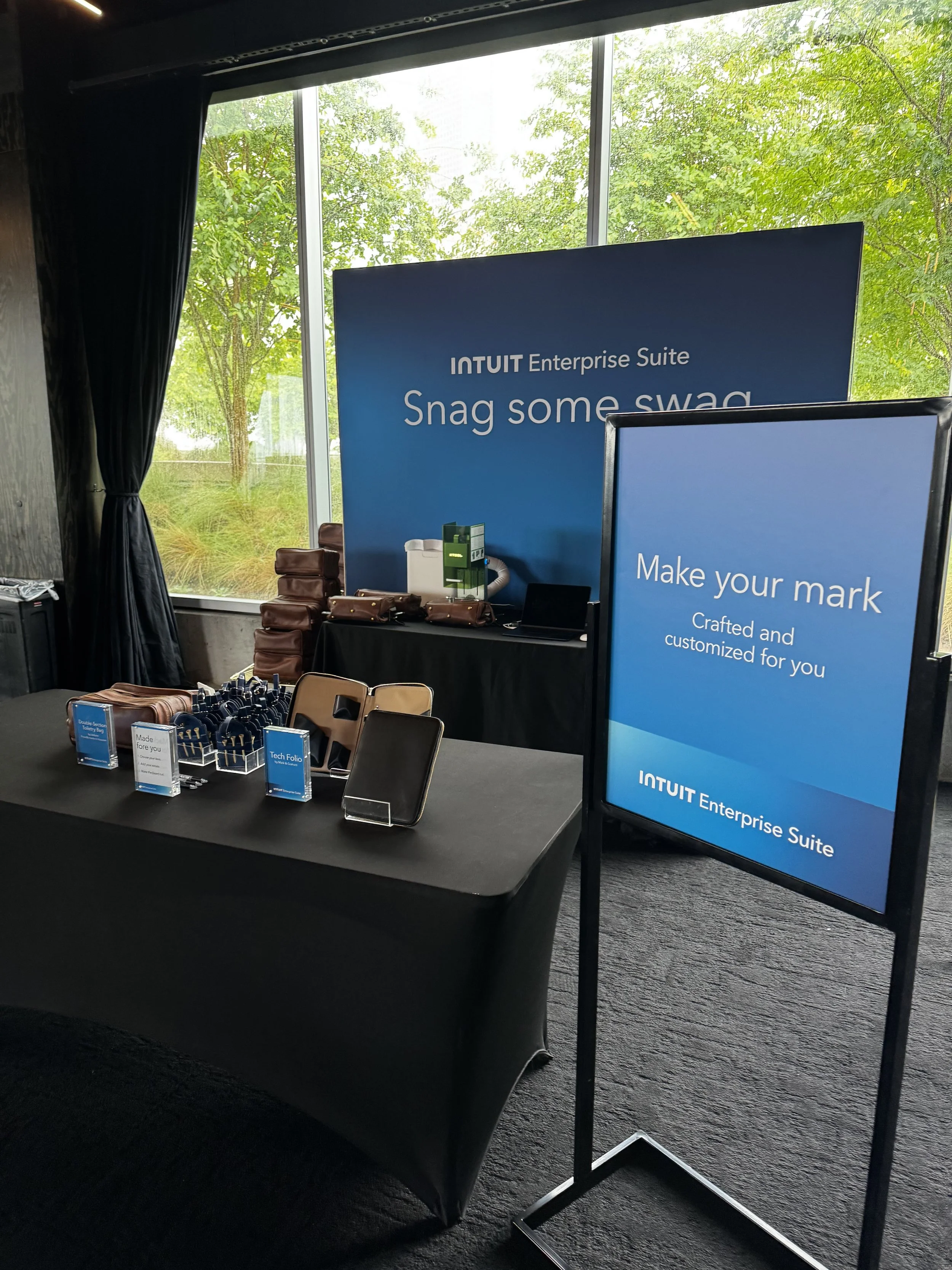 Wayfinding signage calling attention to station where guests can have their items laser engraved