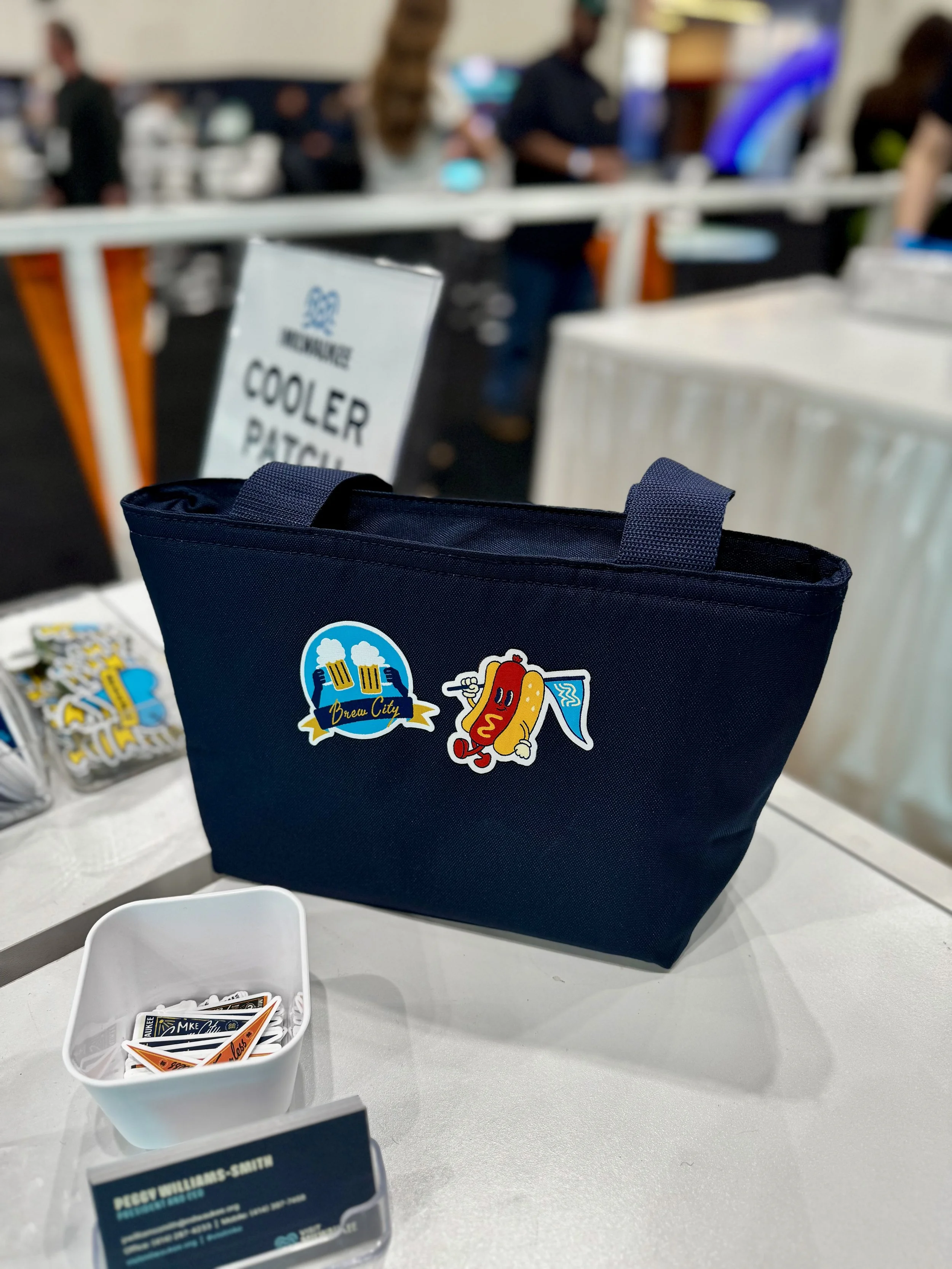 Example of Navy colored cooler tote with fan favorite hot dog carrying pennant flag