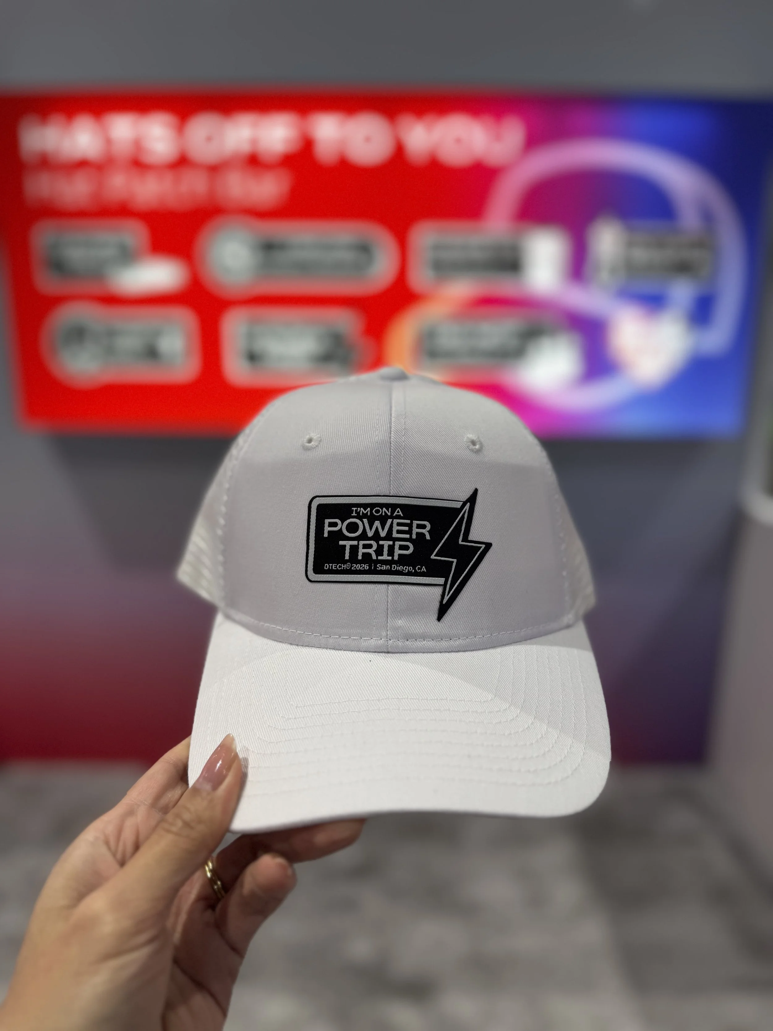 Example of one of the many possible combos of hat and patch available to be heat pressed live on site at Dtech 2026