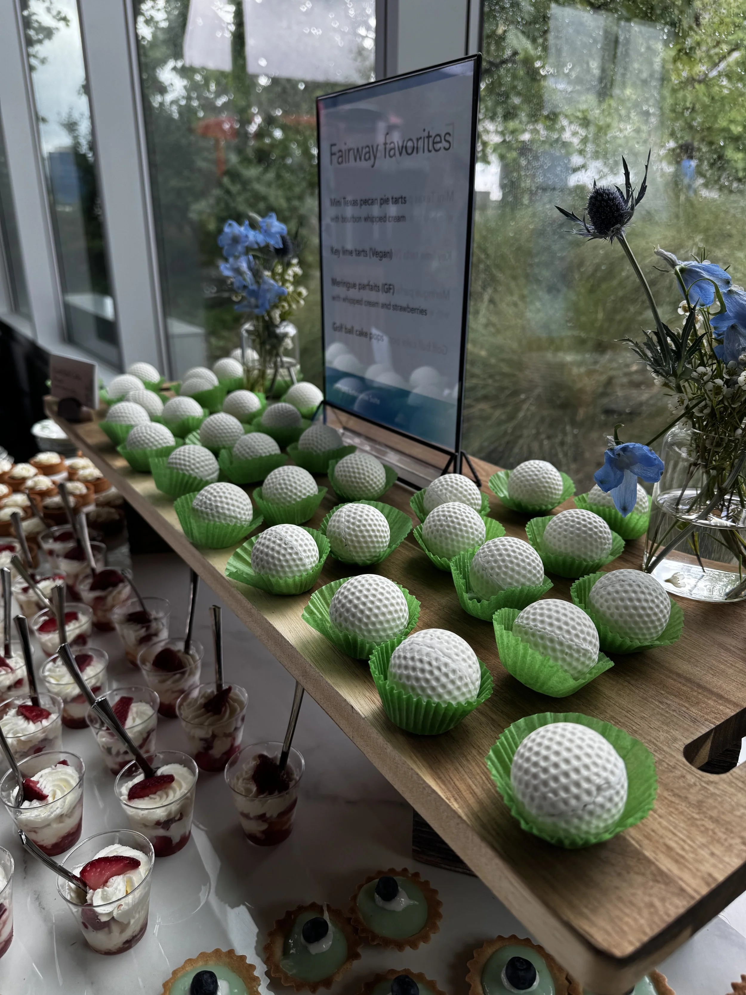 Line up of small sweet bites including Golf Ball molded chocolates