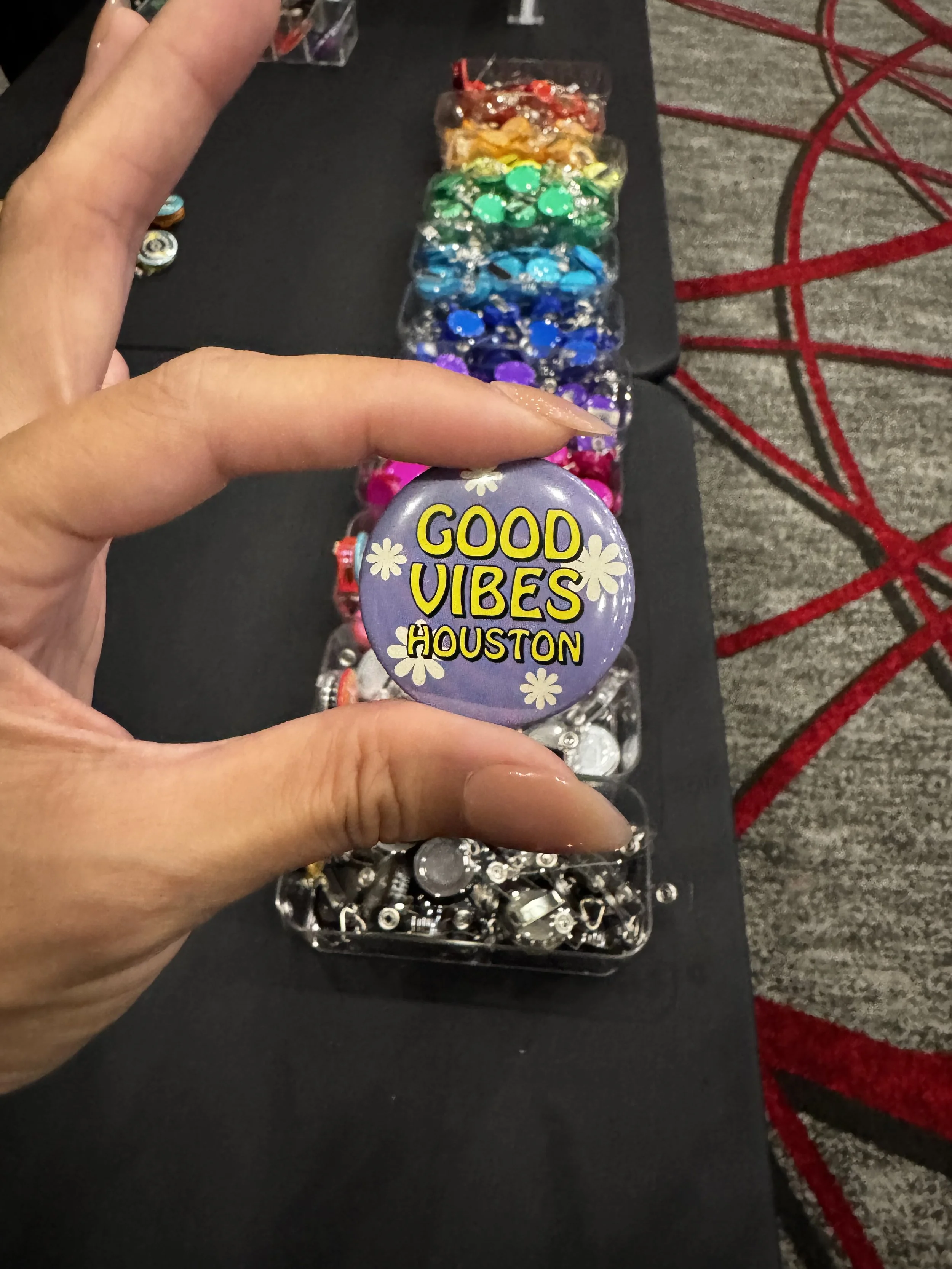 Example of one of 6 designs that could be pressed live into buttons or badge reels at houston first employee appreciation event