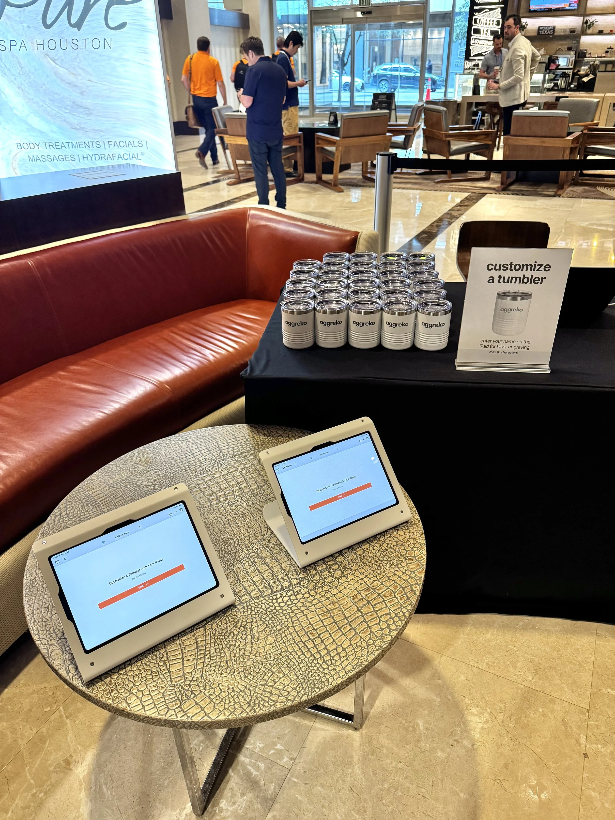Table set up with I pads for guests to fill in their info and what they would like to be engraved