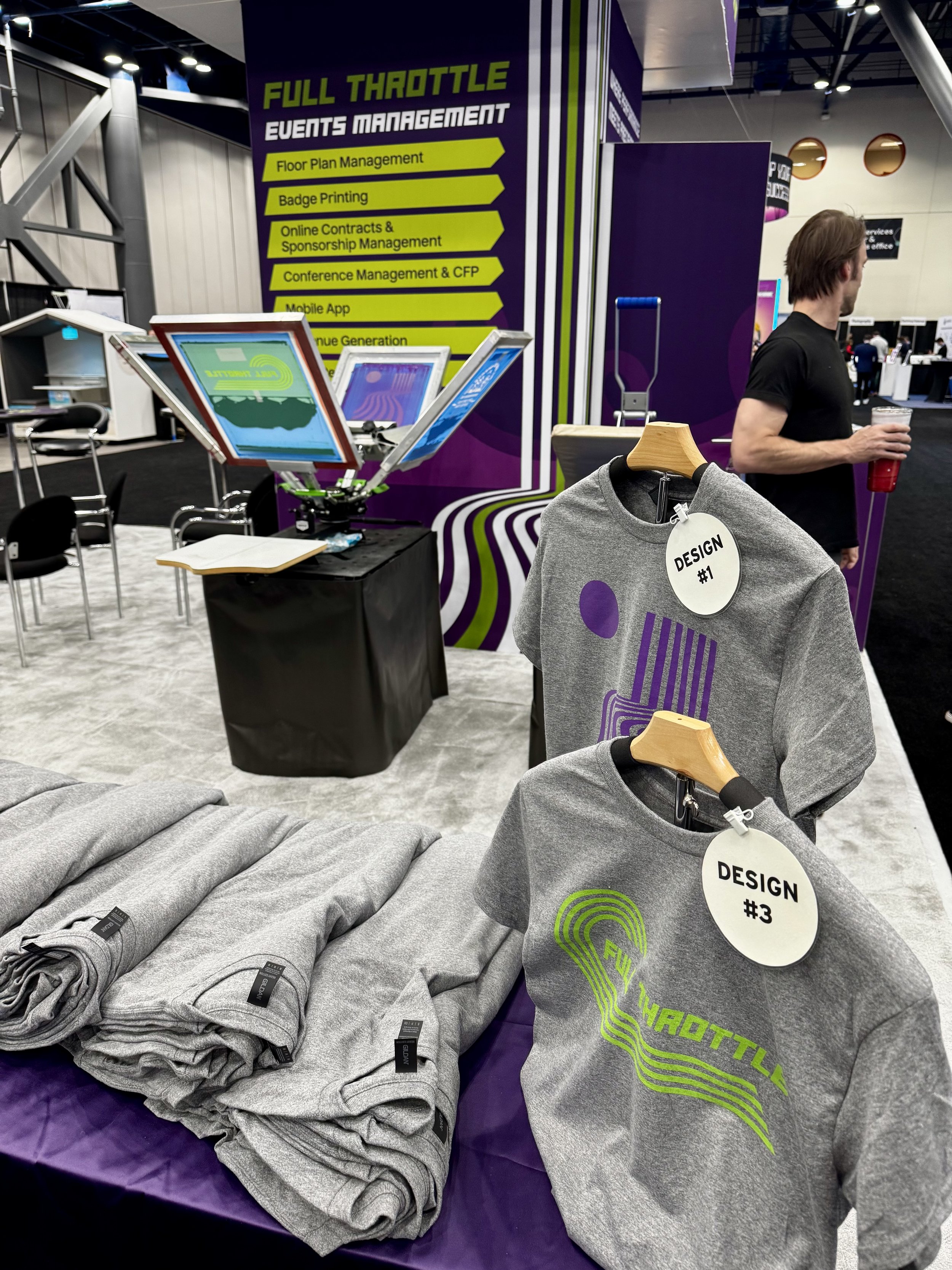 Ready for the chaos to begin, we set the table in a way that displays shirt styles and makes it easy to pull guests sizes and get them printed on site in front of their very eyes