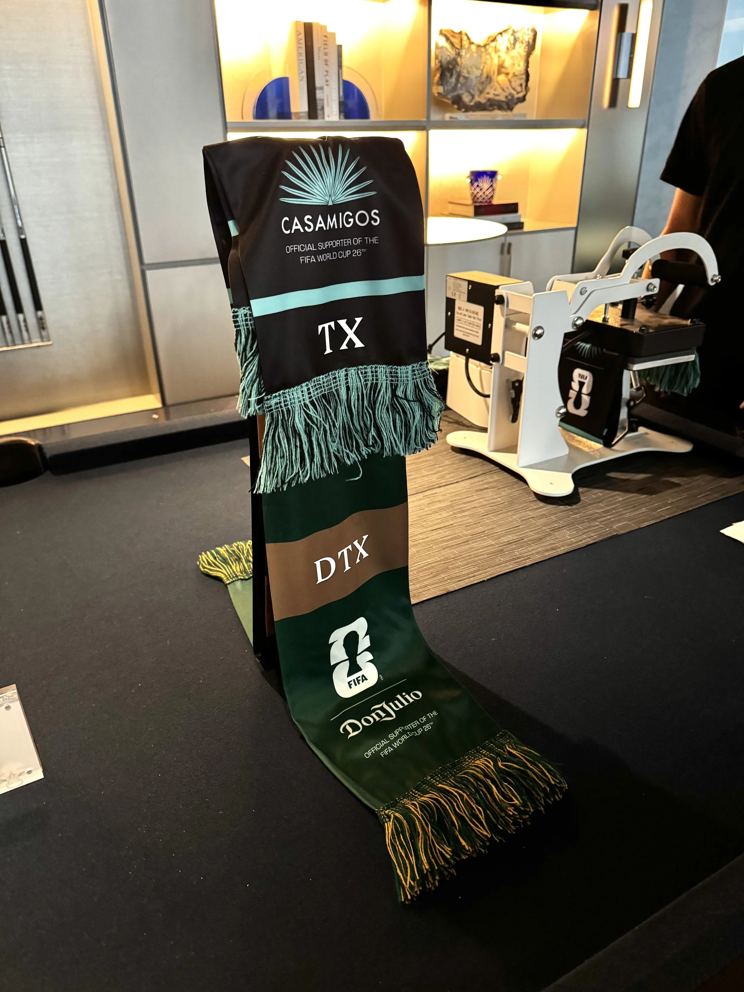 Two different offerings of scarf styles at the world cup watch party where we did live monogramming