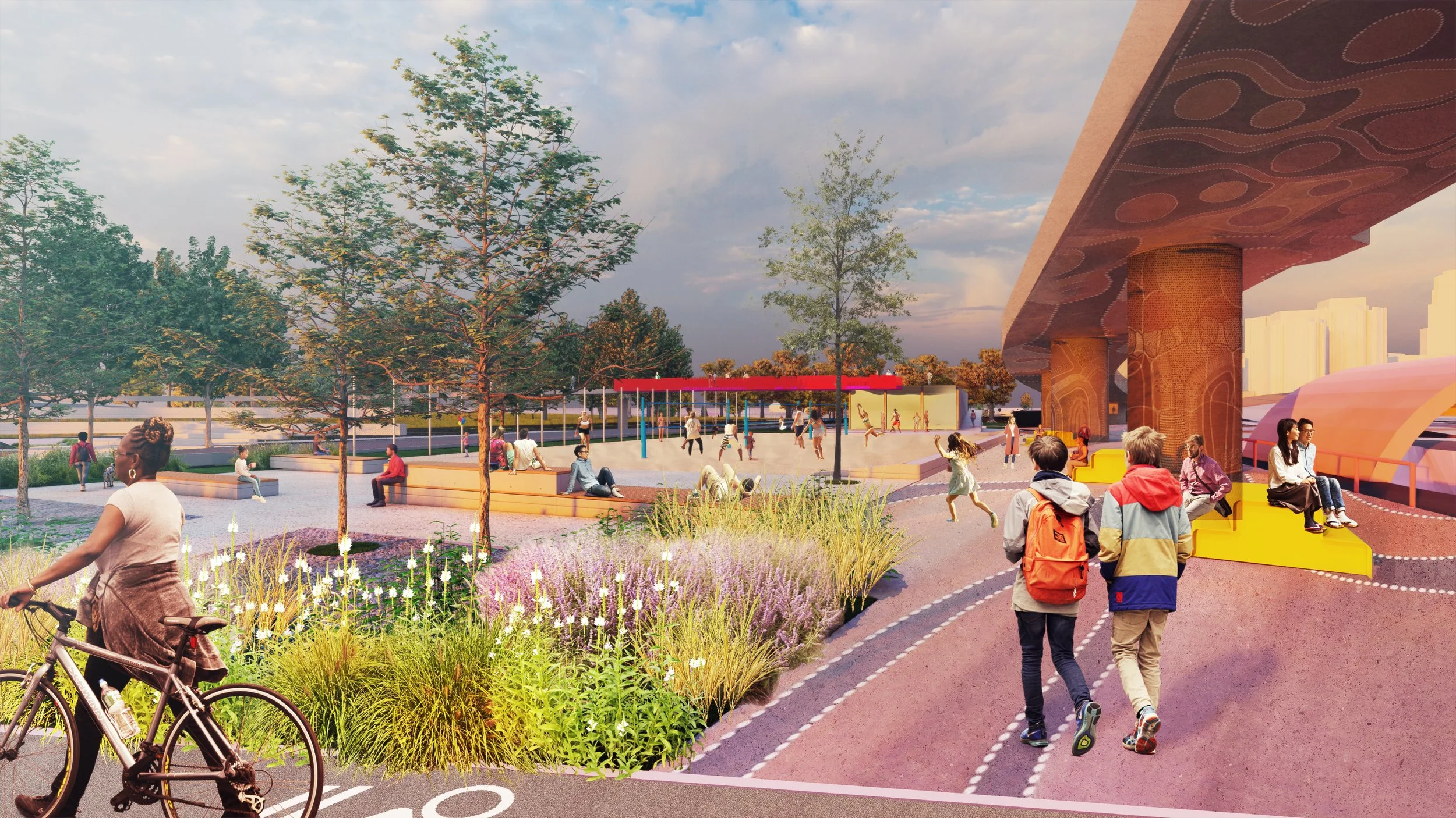 People walking and cycling in an urban park with trees and seating areas, under a bridge with decorated pillars, and a playground in the background.