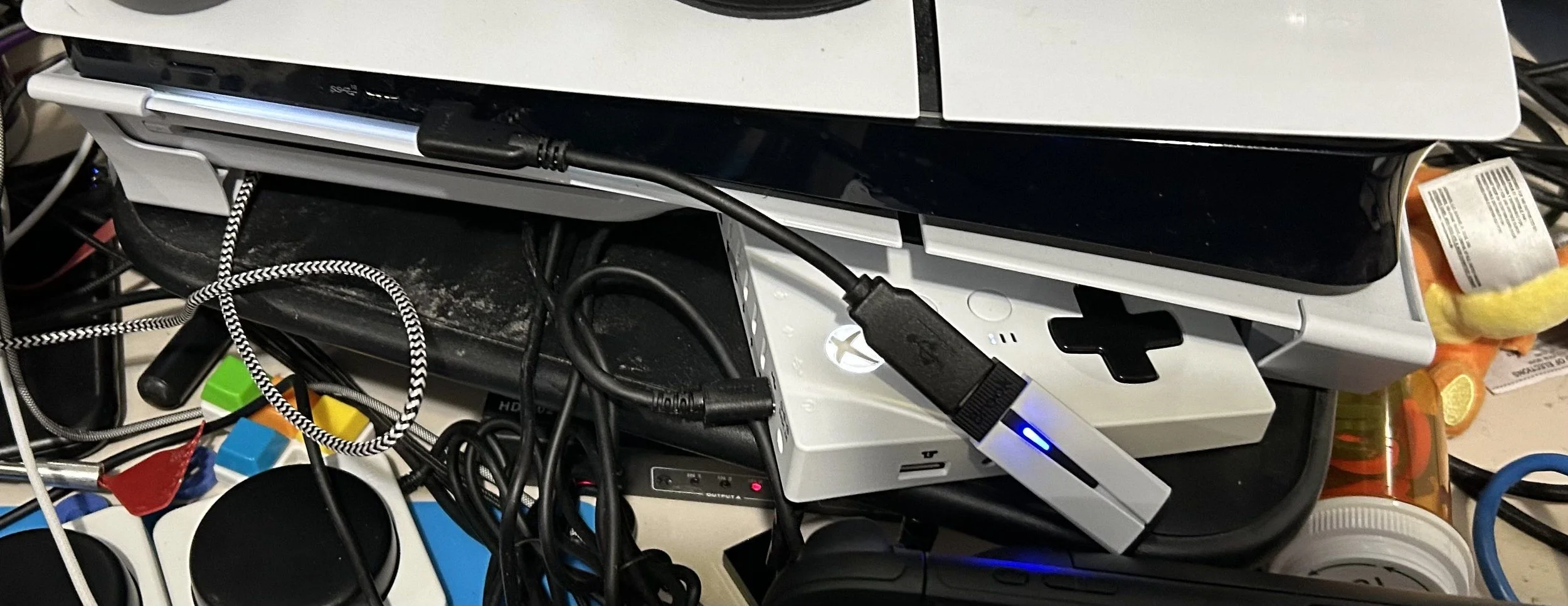 Image of the Wingman P5 converter connected to PS5 Slim via a USB-C-to-USB-C adapter