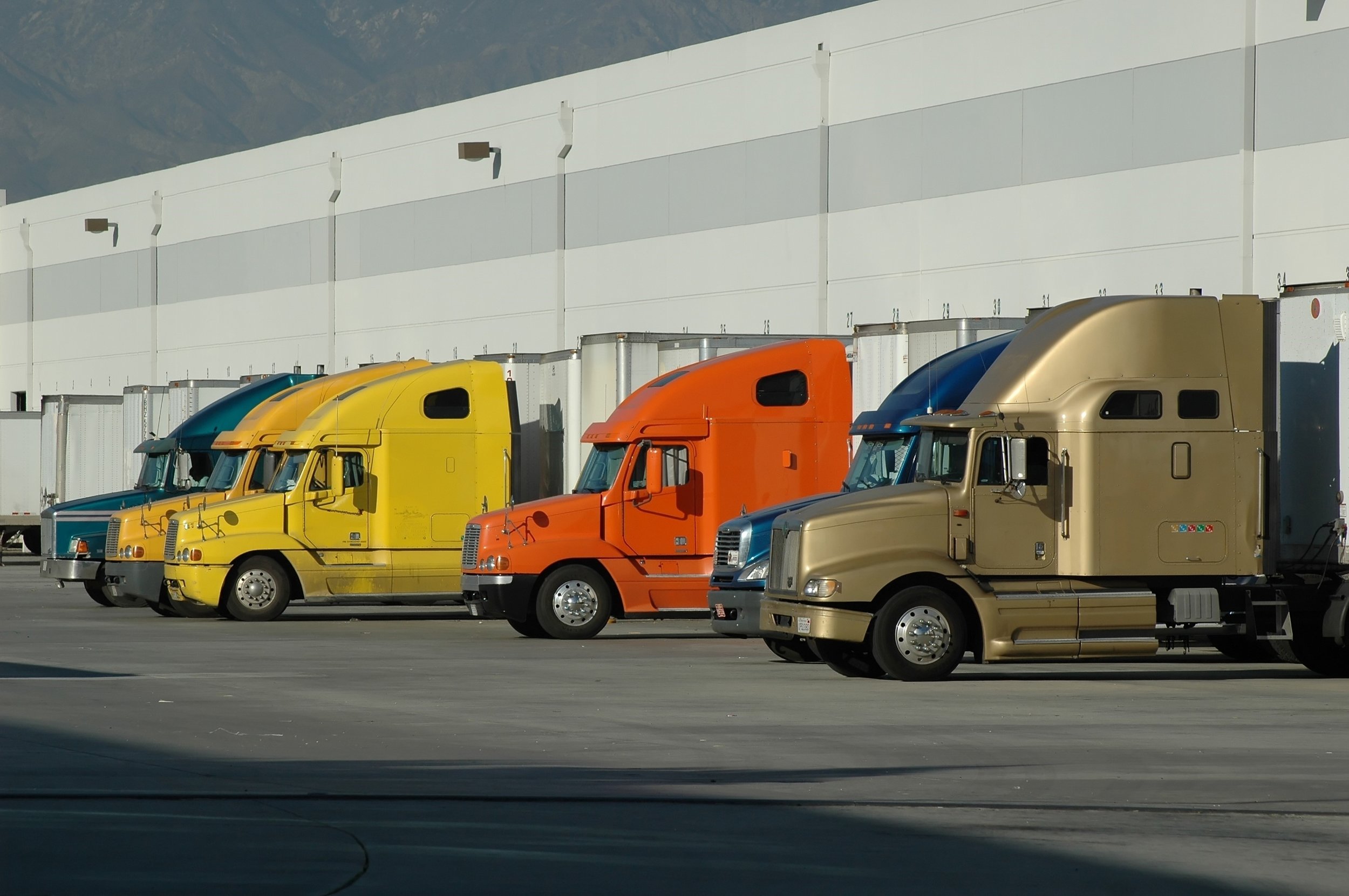 bigstock-Trucks-And-Warehouse-1129204.jpg