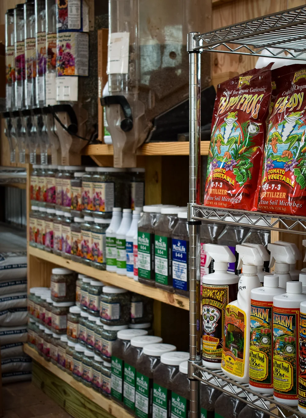 Organized shelves of fertilizers to suit all kinds of specific needs at Enchanted Forest.