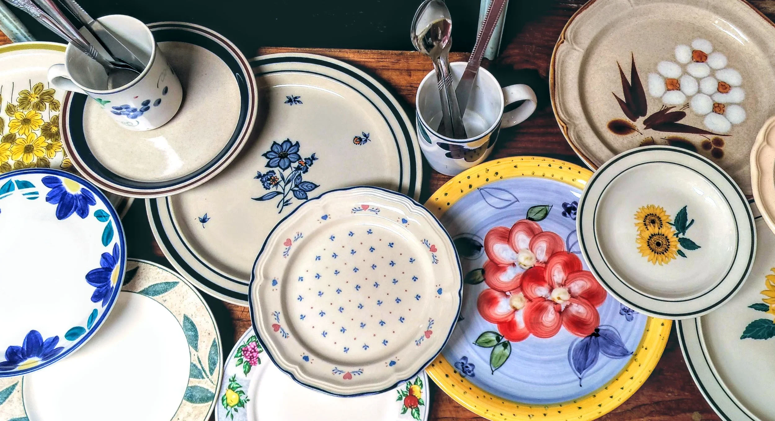 A snapshot of our extensive collection of second-hand dishware. The delightful colors and designs make clean-up a little less of a chore.