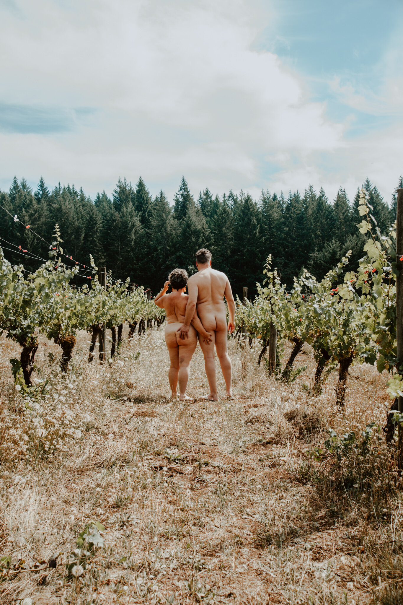 Naked couple in vineyard