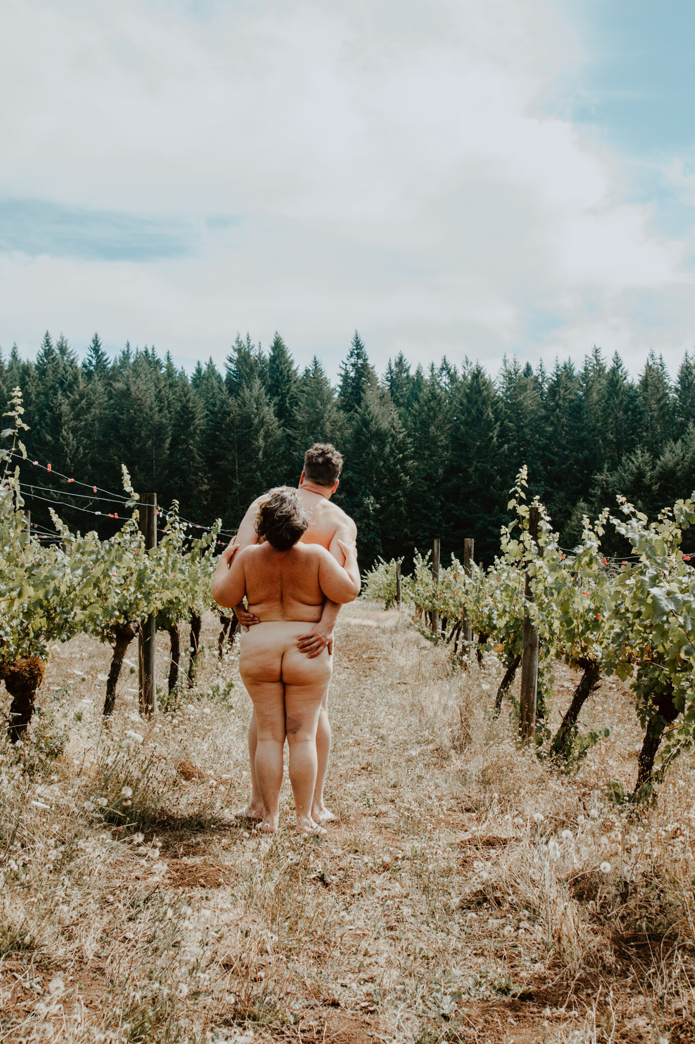 Naked couple in vineyard
