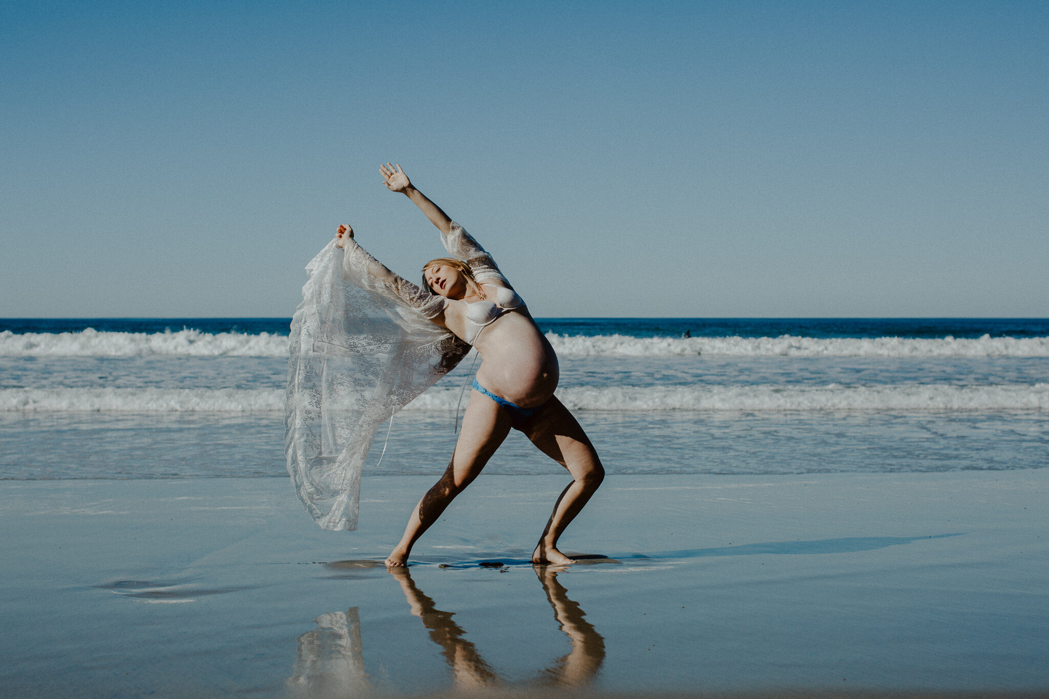 Prego woman dancing on beach