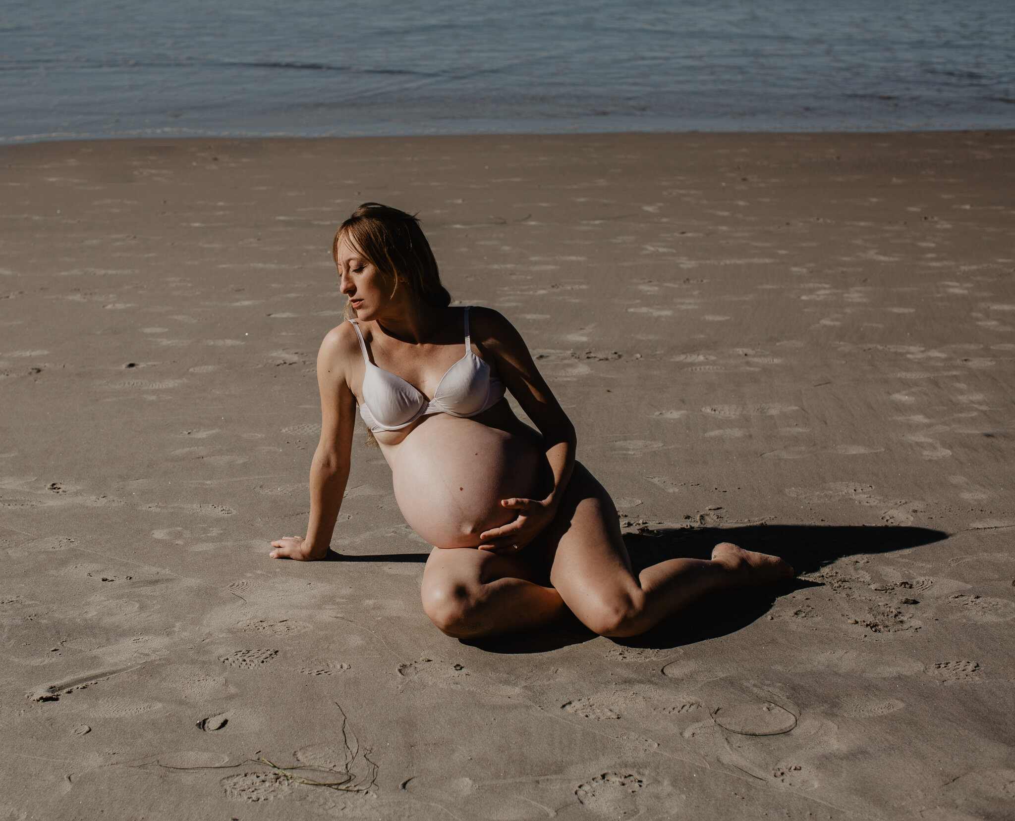 Maternity portrait on beach in Oregon