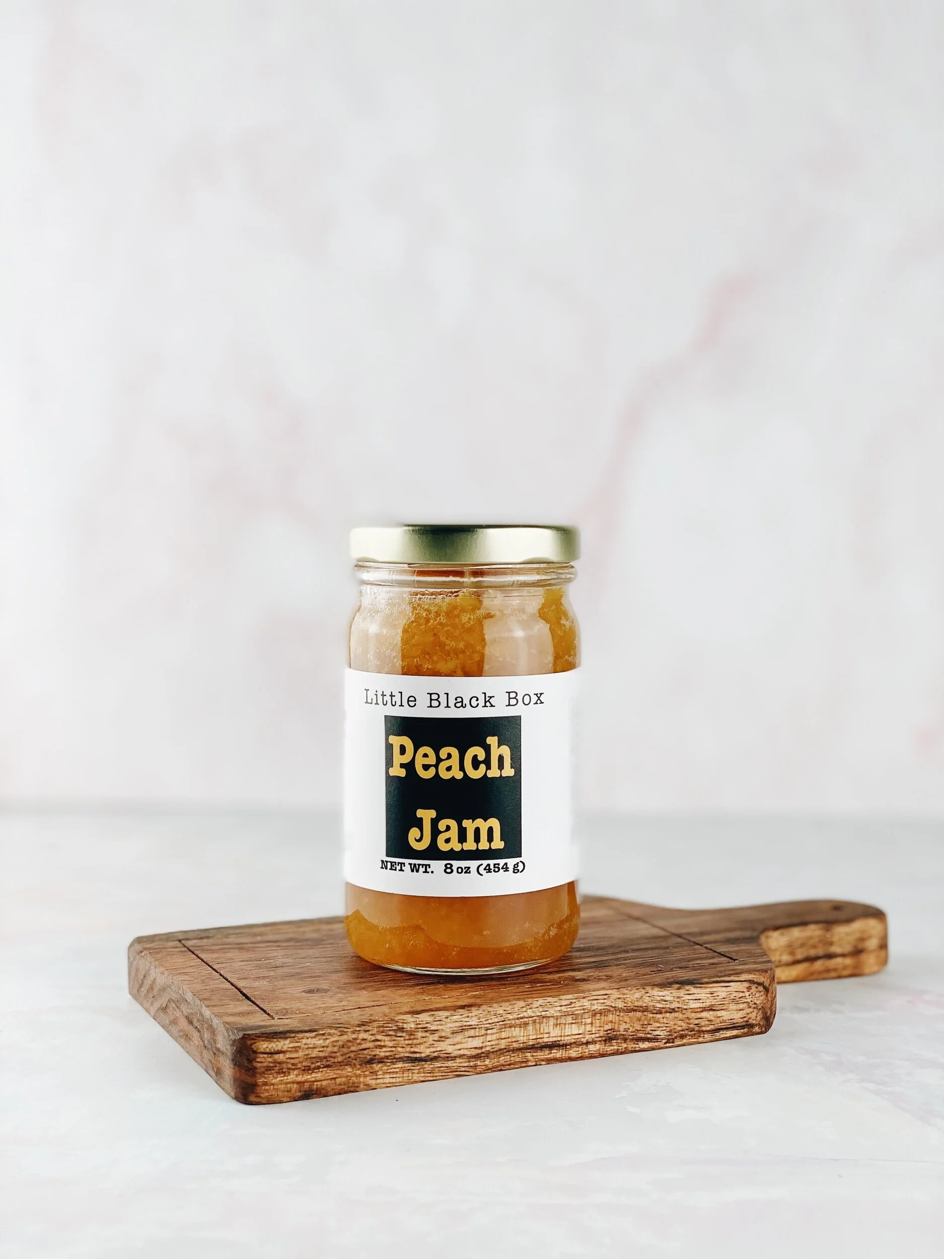 Peach Jam on small cutting board