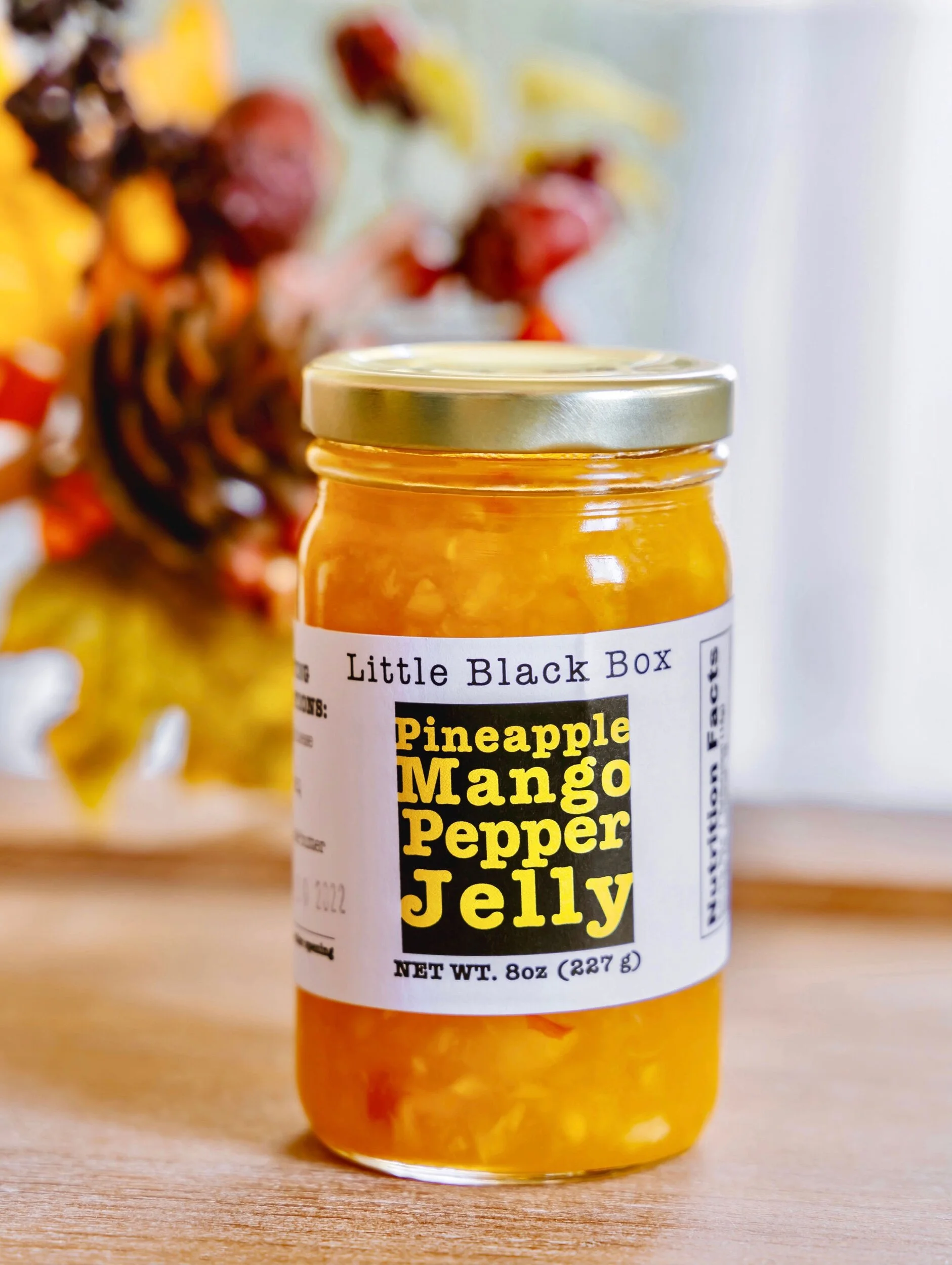 mango pepper jelly with fall décor in the background