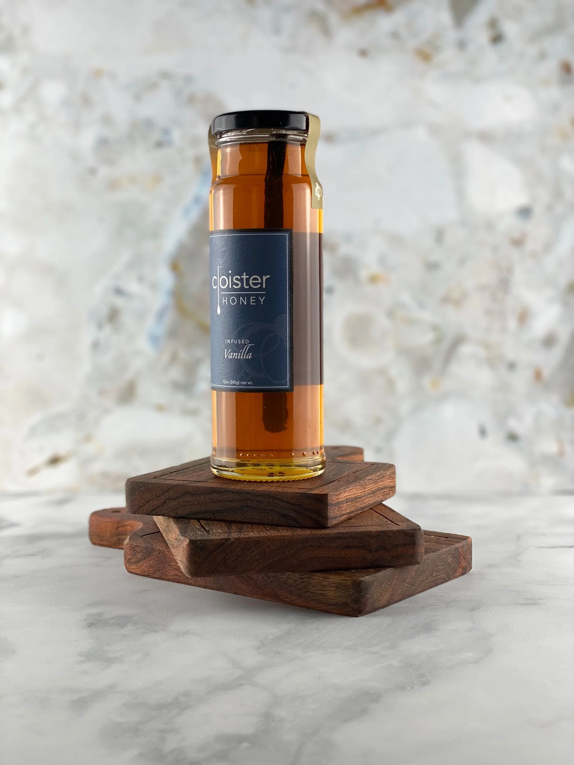 Vanilla infused honey with whole vanilla bean in bottle.