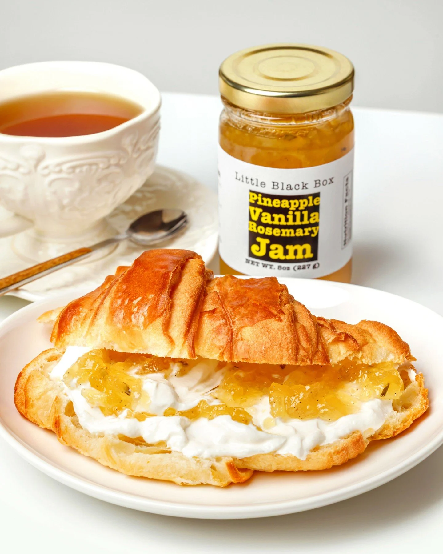 A warm croissant, a little yogurt (yes, I know) or cream cheese and just enough jam. Breakfast of champions? We like to think so.