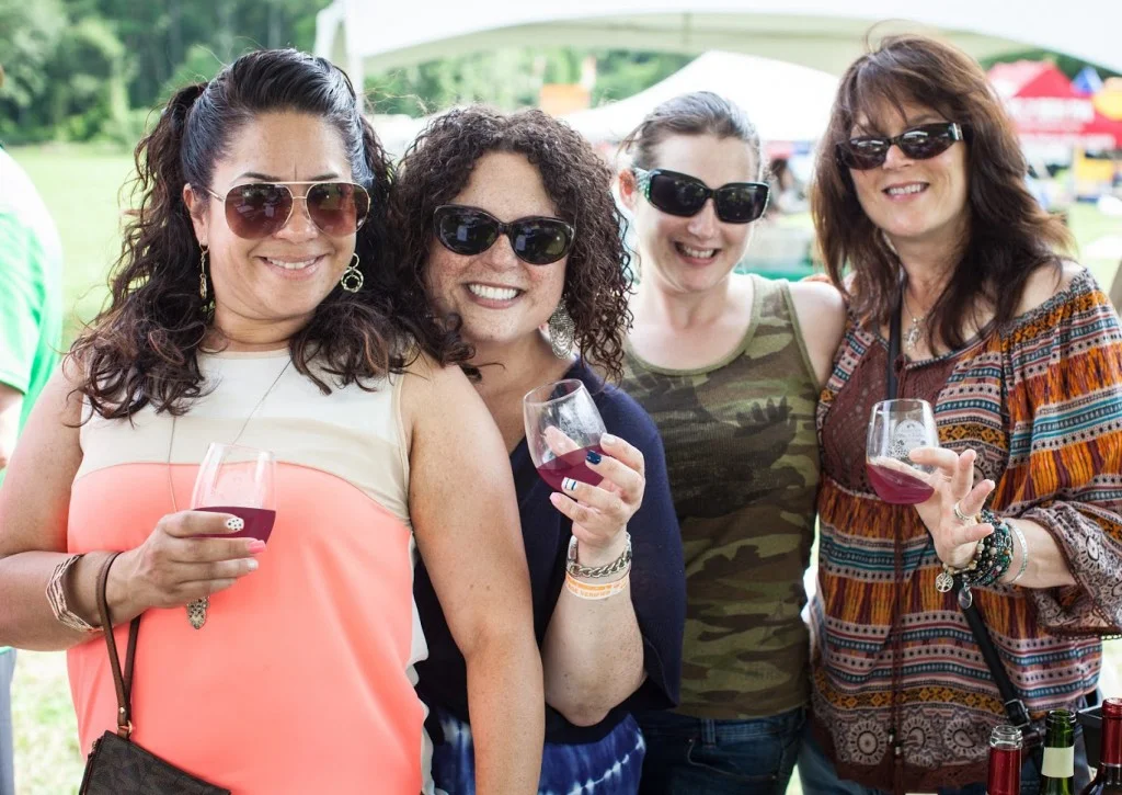 MusicWineFestLadiesPosingWithGlasses_RedWine-1024x725.jpg