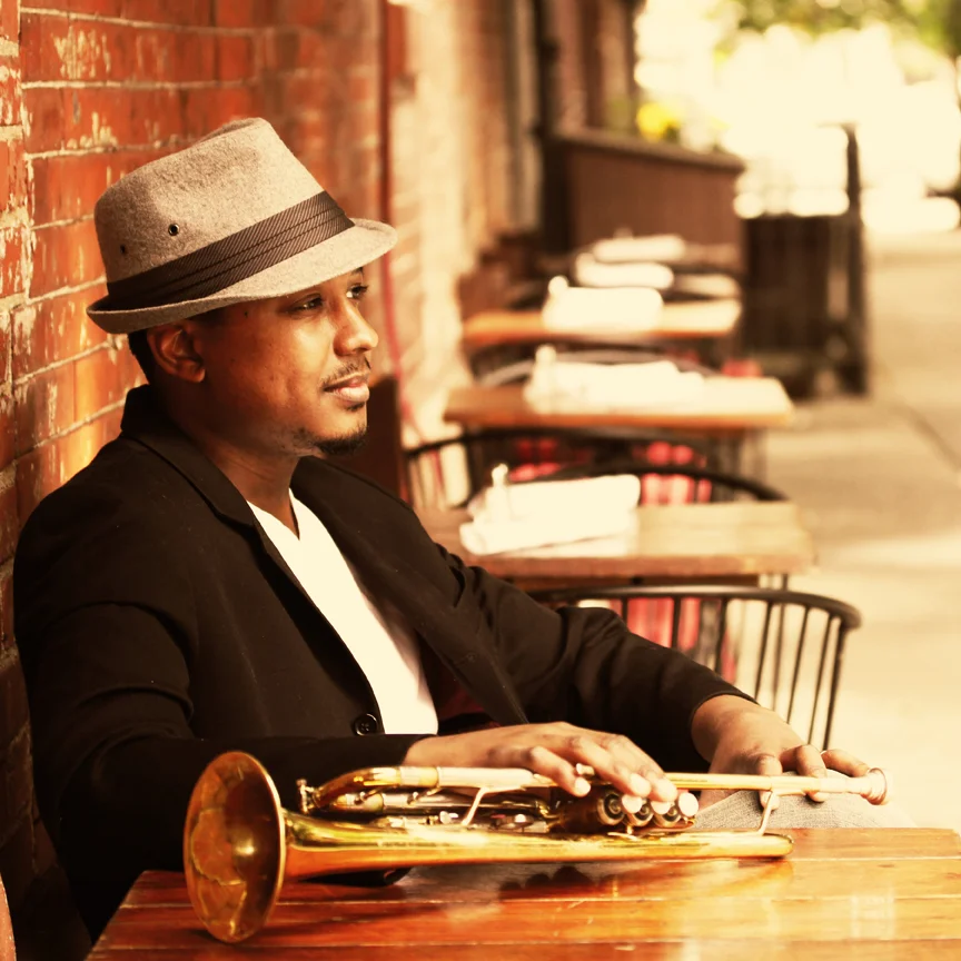 Lee-Hogans-at-table-w-trumpet_lowres.jpg